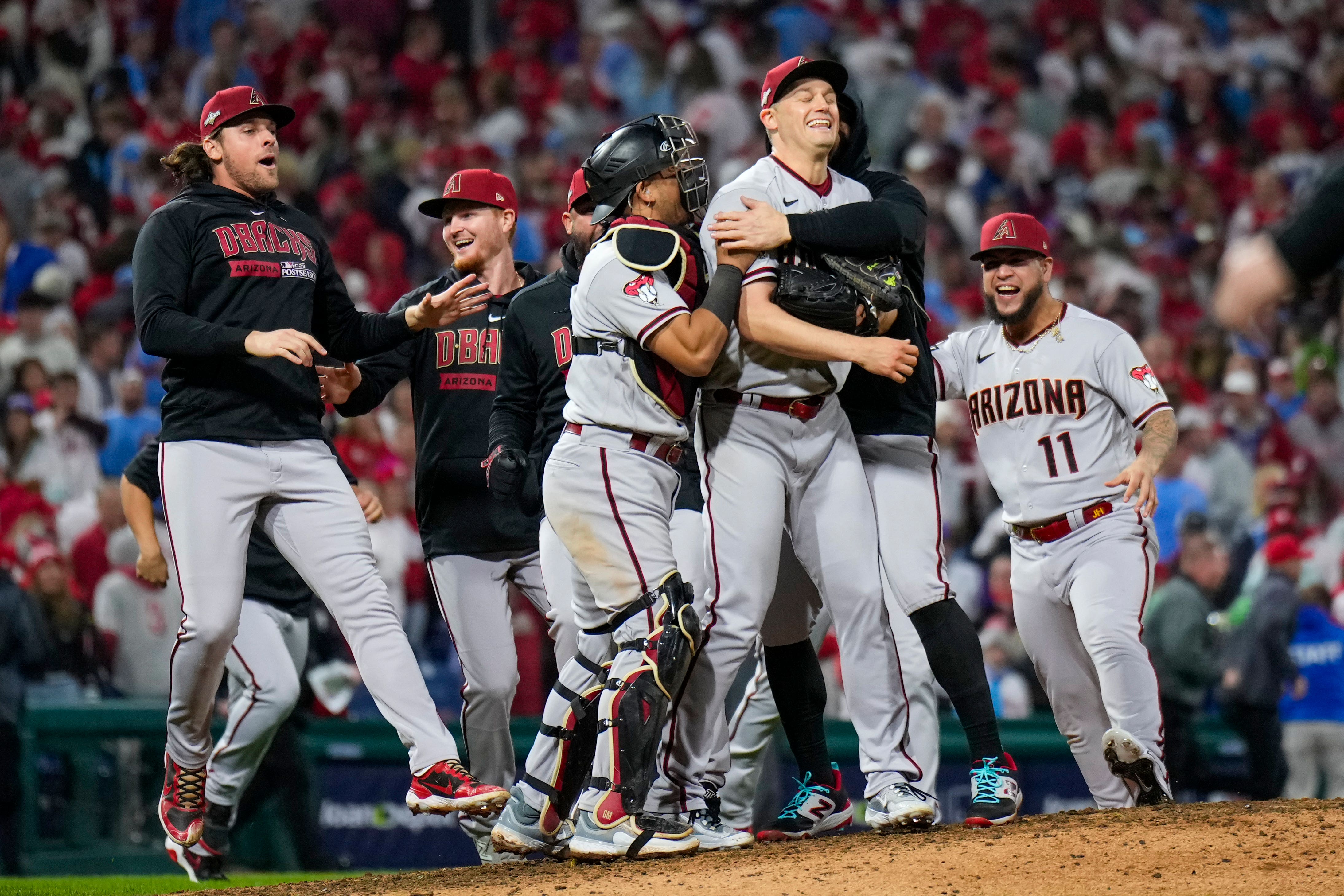 The Arizona Diamondbacks celebrate their win against the Philadelphia Phillies (Matt Slocum/AP)