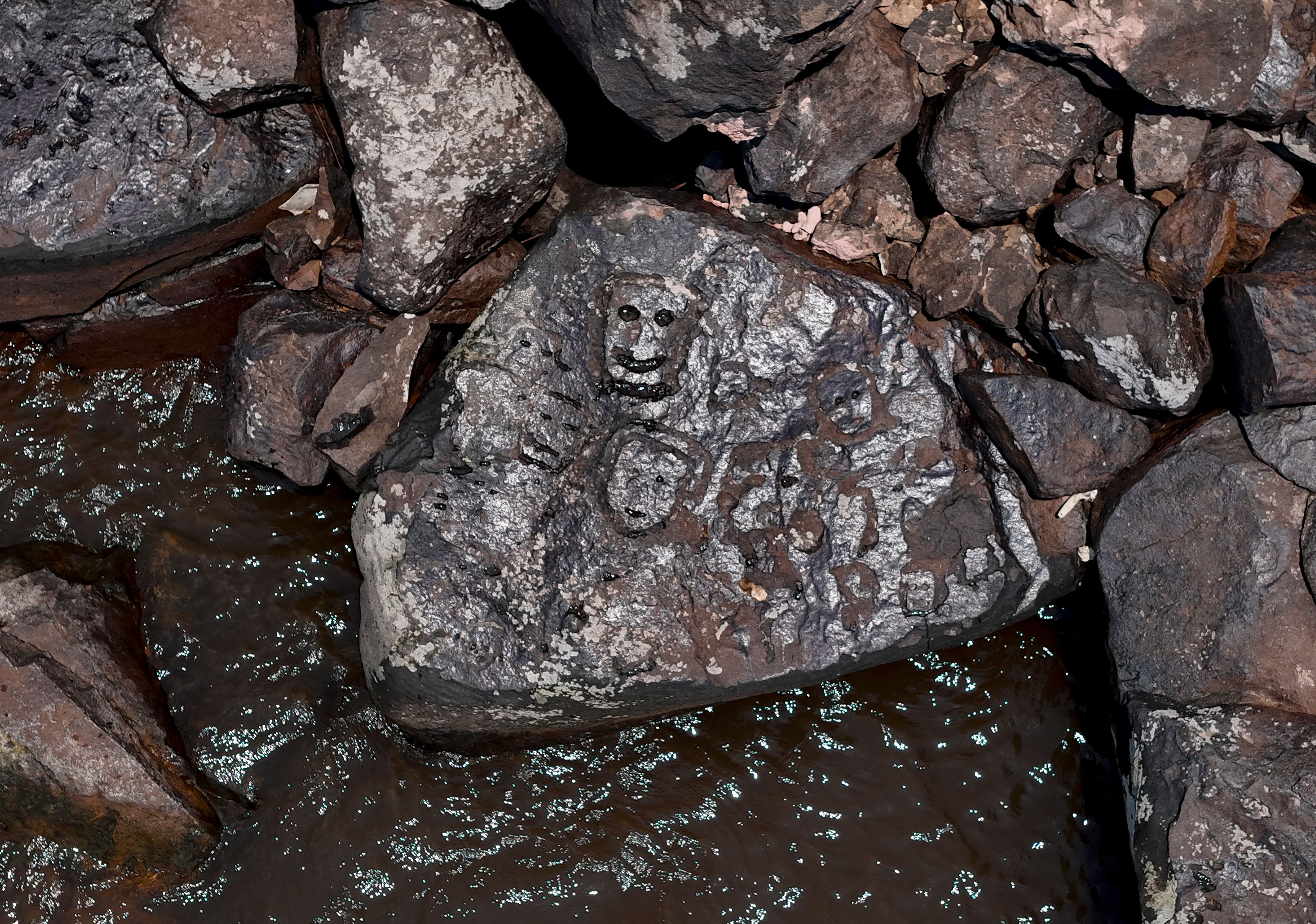 Ancient rock carvings that reappeared in the region of the Lajes Archaeological Site due to the severe drought affecting the region’s rivers are pictured on the banks of the Negro River in Manaus, Amazonas State, northern Brazil, on 21 October 2023