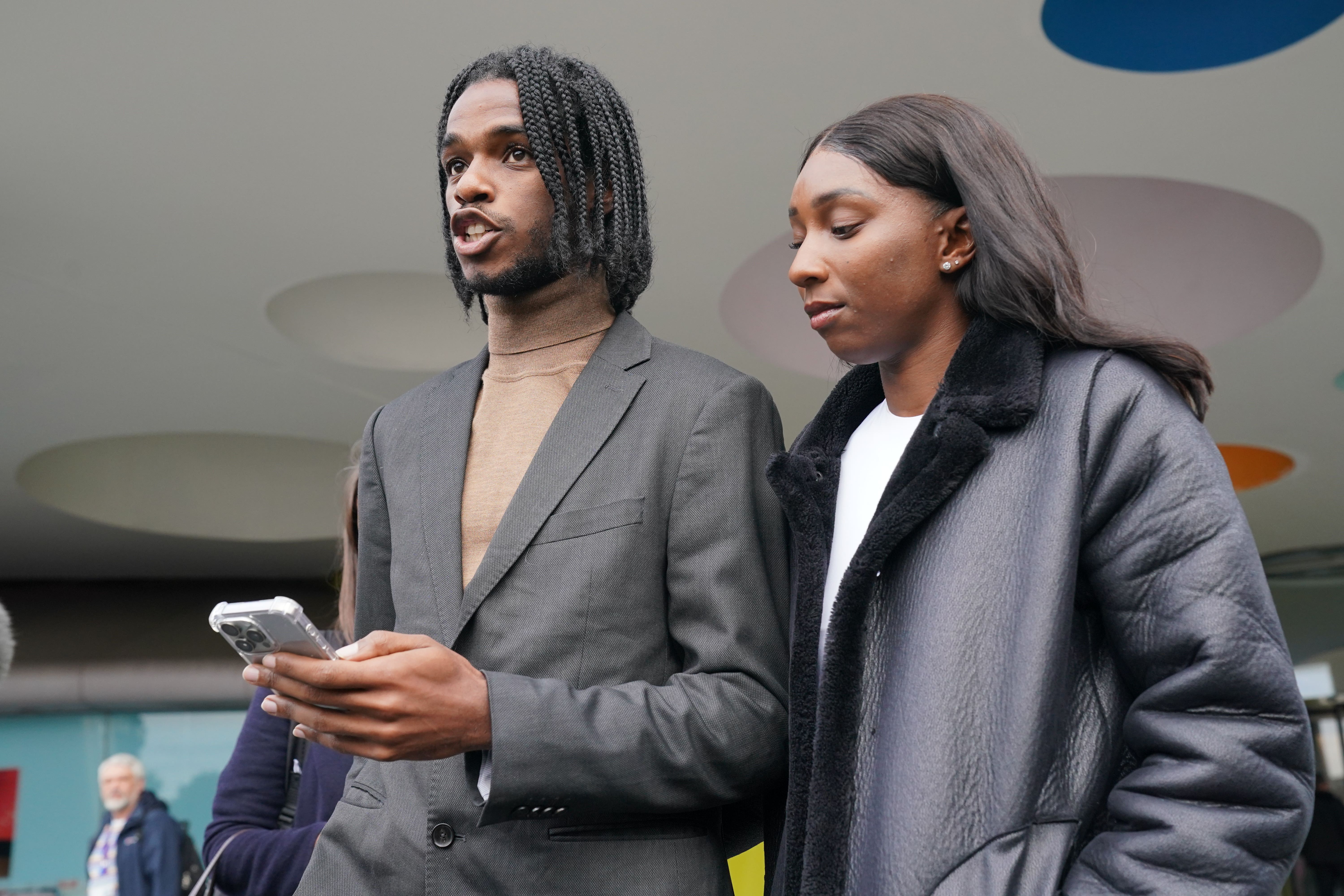 Athletes Bianca Williams and Ricardo Dos Santos speak to the media following the misconduct hearing (Jonathan Brady/PA).