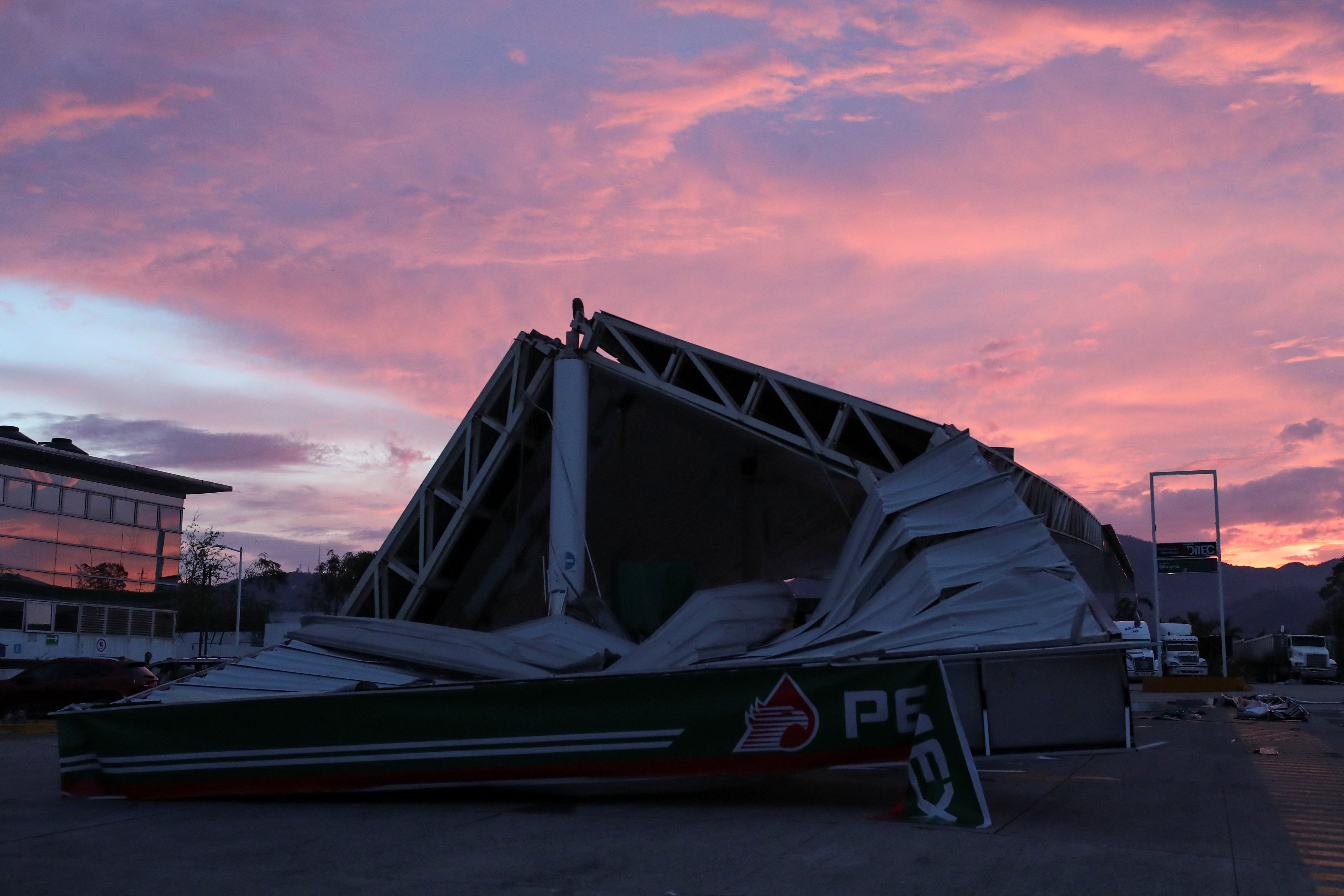 A general view of a damaged PEMEX gas station on a road after Hurricane Otis hit, near Acapulco