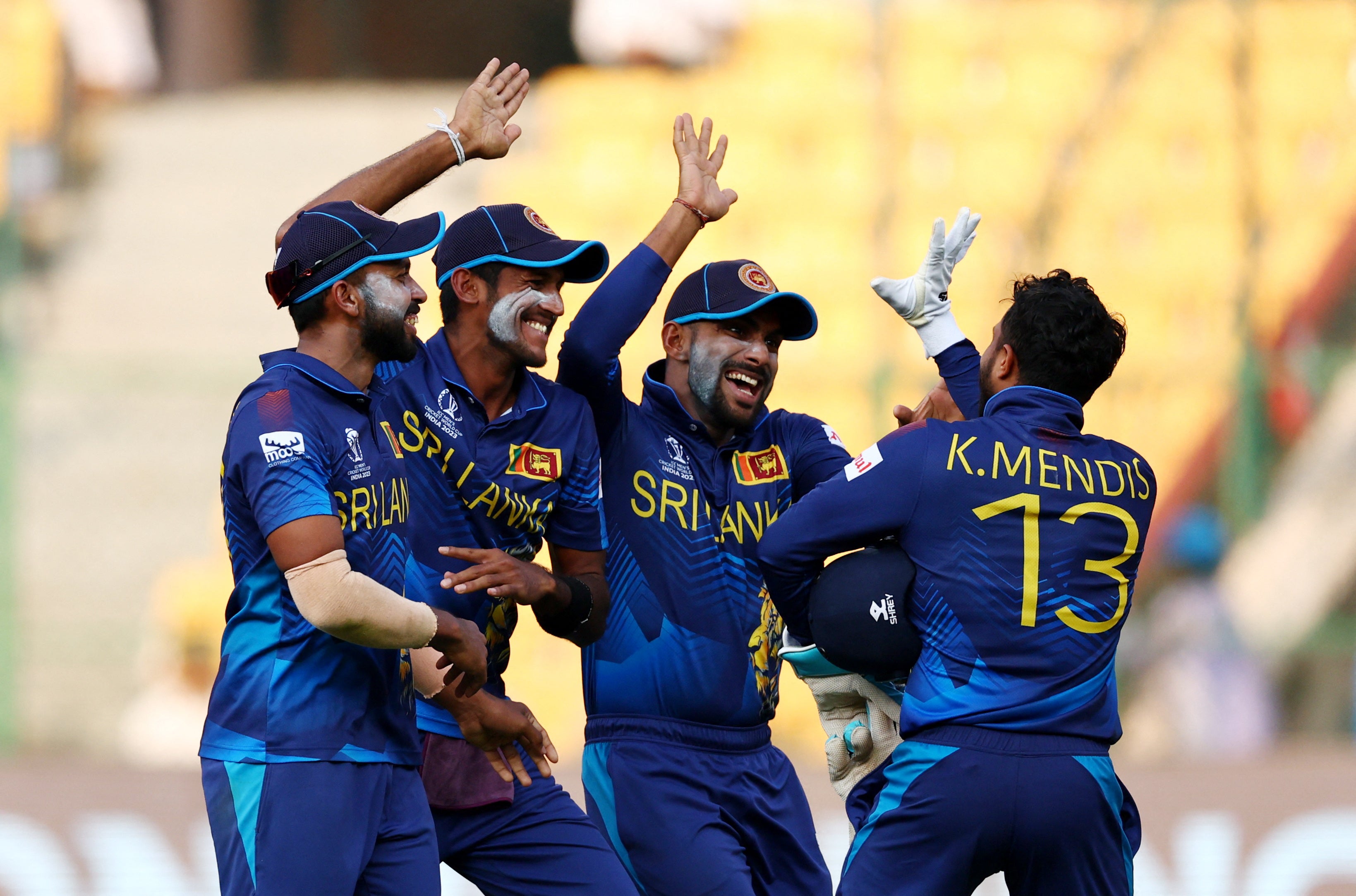 Sri Lanka celebrate the quick-thinking run out to dismiss Rashid