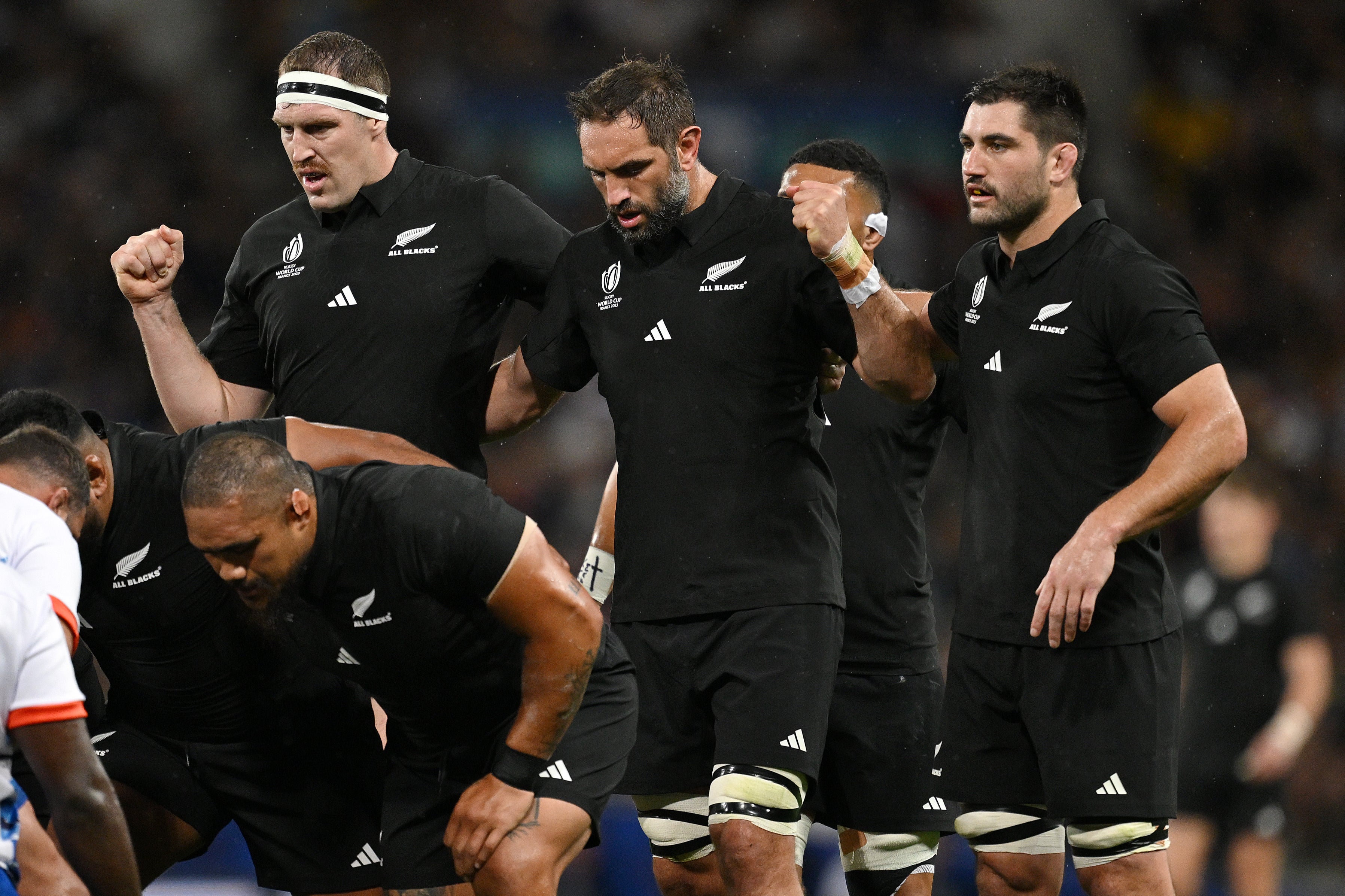 Brodie Retallick, Samuel Whitelock and Luke Jacobson of New Zealand prepare for a scrum