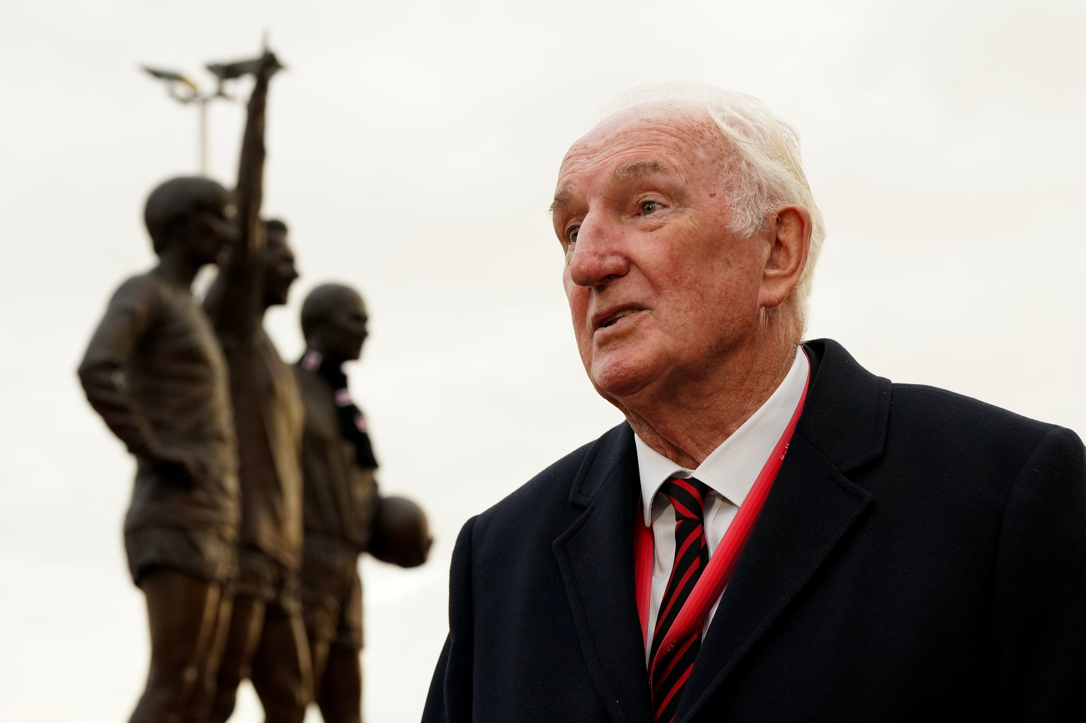 Former Manchester UNited player Alex Stepney visits the tributes in memory of Sir Bobby Charlton