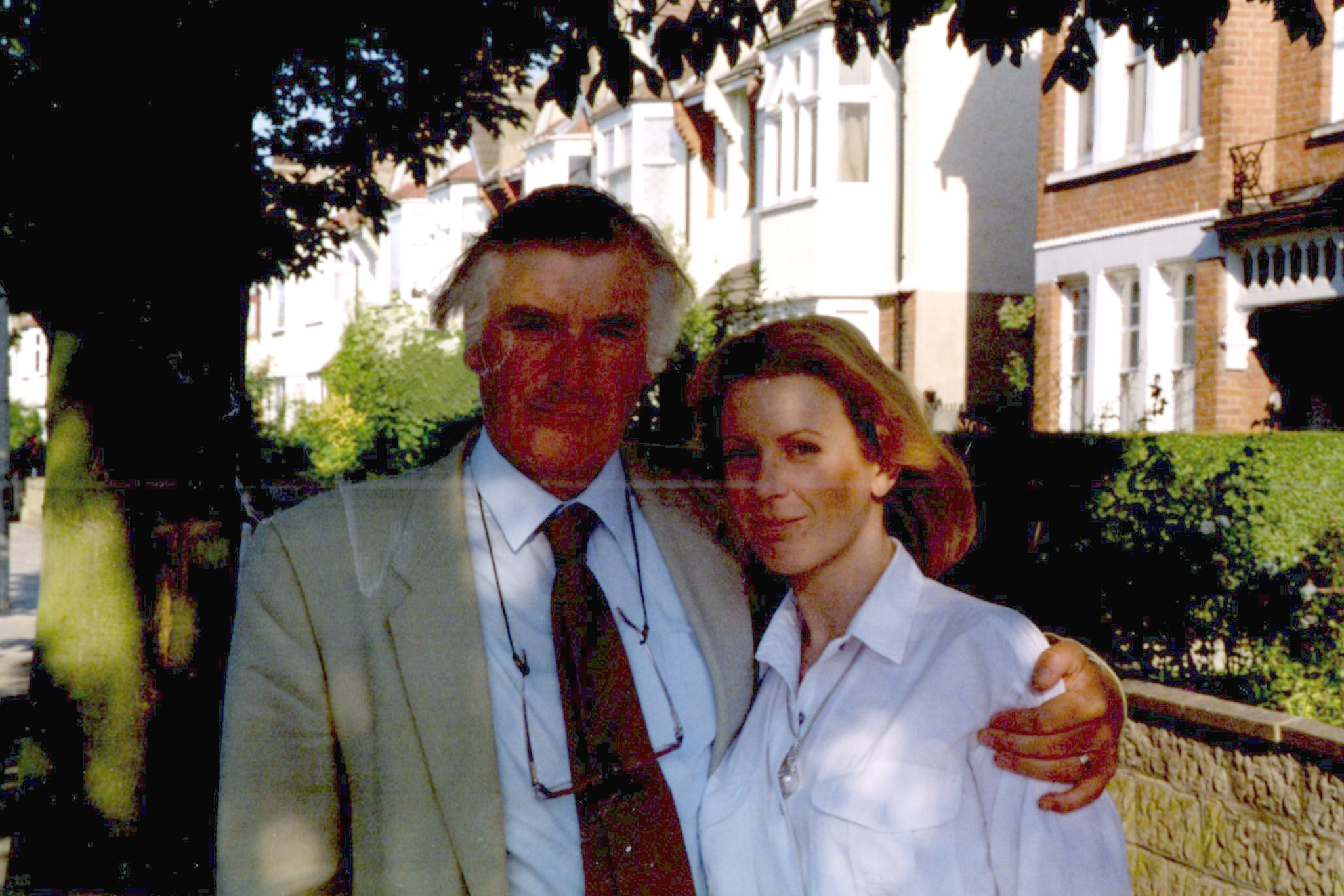 In this exclusive family photo, Frieda stands embraced by her father, Ted Hughes