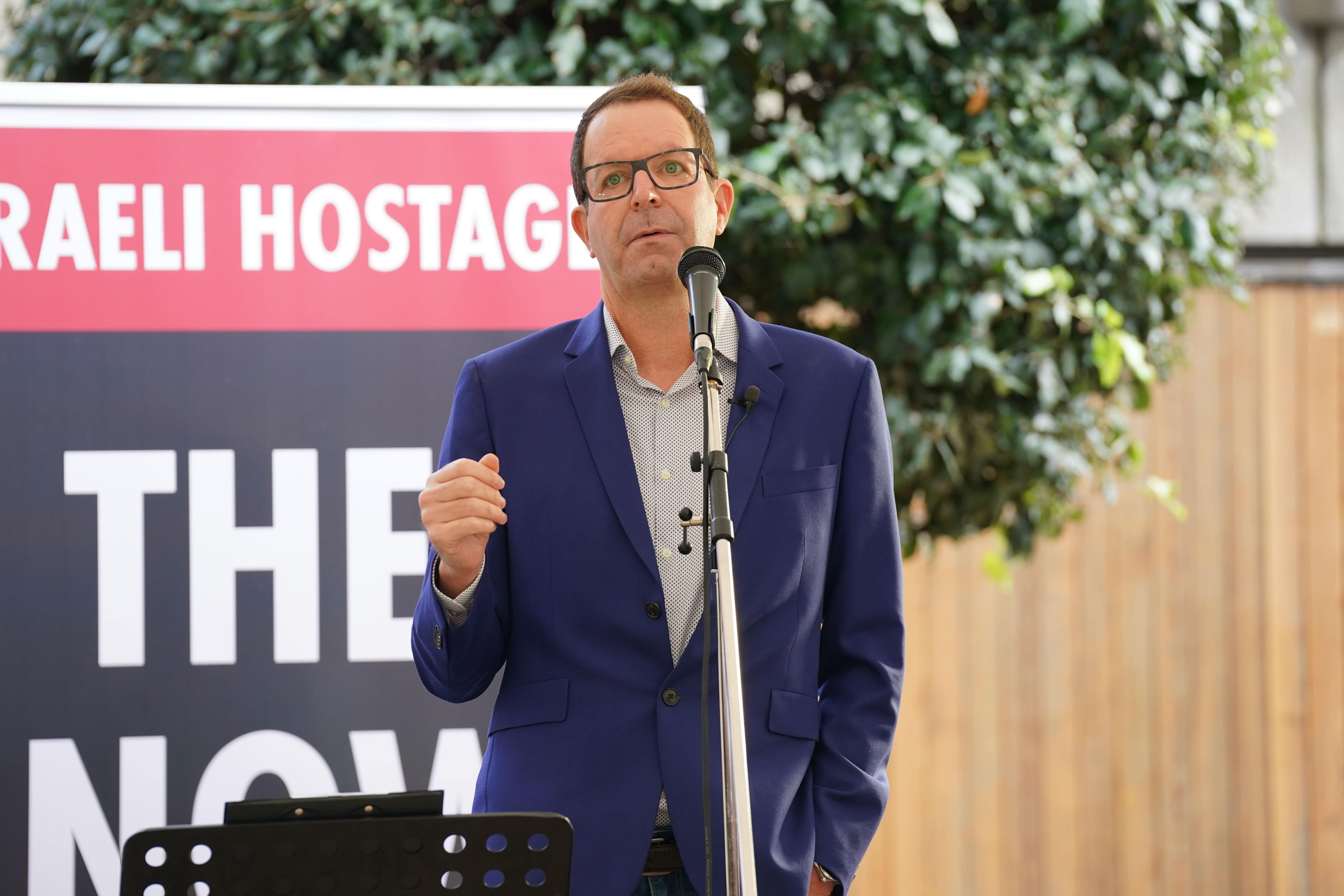 Noam Sagi speaking at the Empty Shabbat Table installation, an empty dining table set for Shabbat which raises awareness of the more-than 200 Jewish hostages being held by Hamas in the Israel-Hamas conflict, at JW3 in London. Picture date: Friday October 27, 2023. (Lucy North/PA)