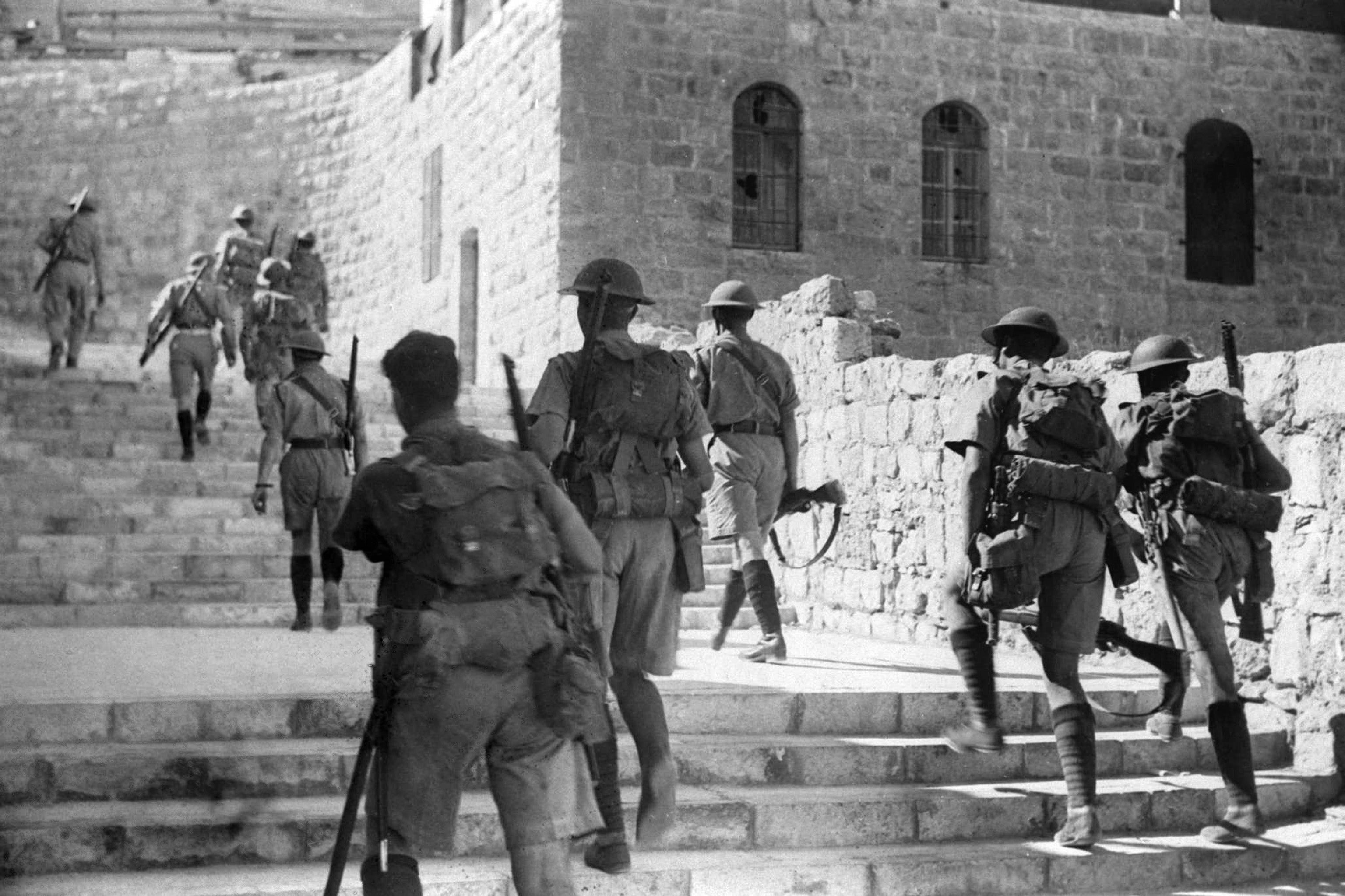 British soldiers enter the old city of Jerusalem to impose a curfew following Arab rioting against Jews during the British mandate in Palestine, 19 October 1938