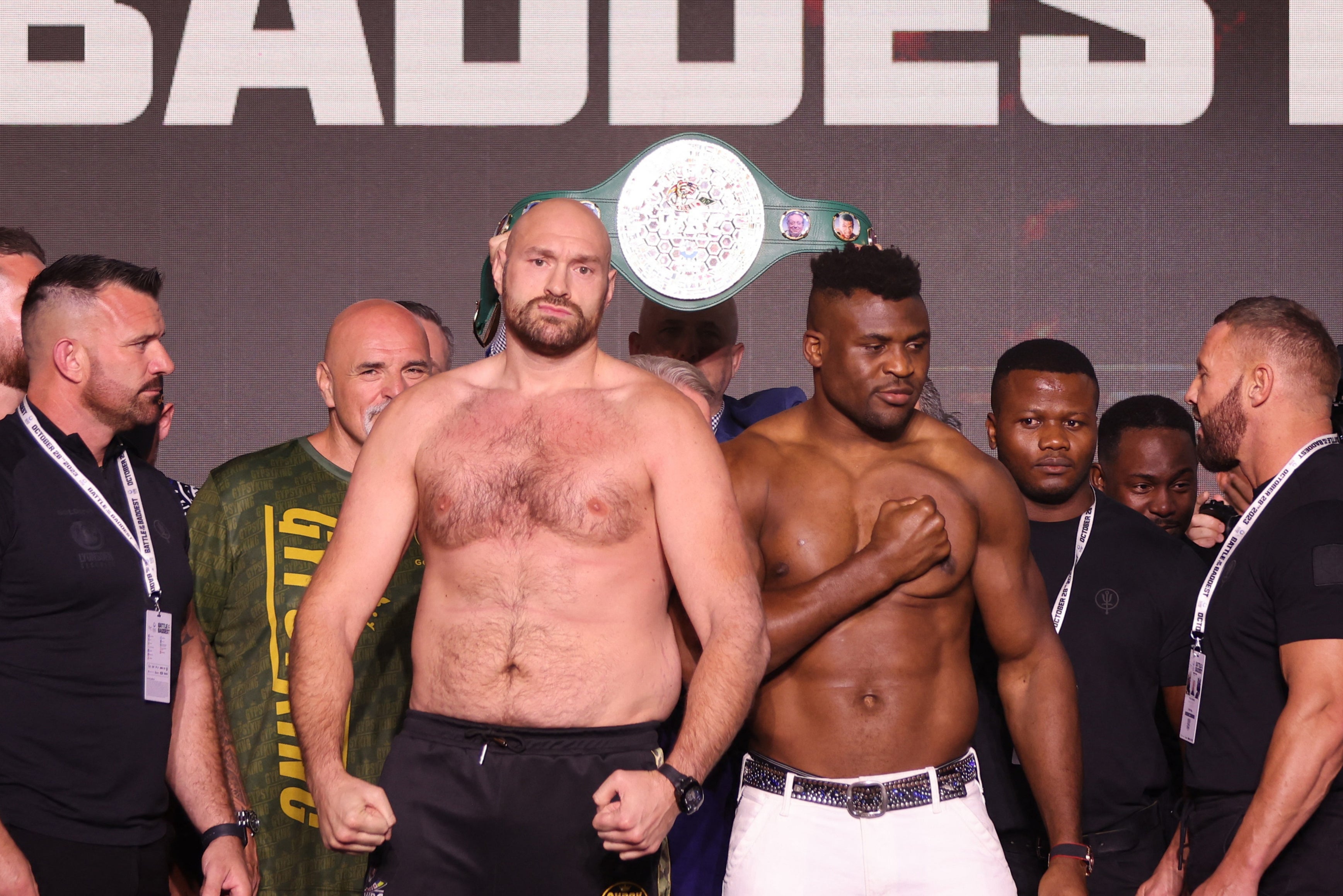 Tyson Fury, centre left, and Francis Ngannou at their weigh-in