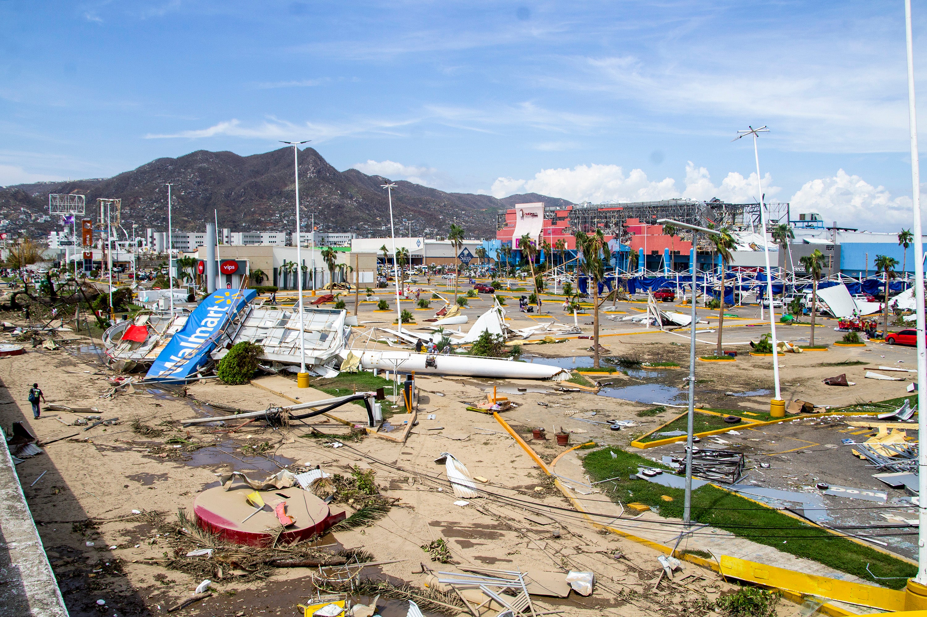 A view of a damaged parking lot after hurricane Otis