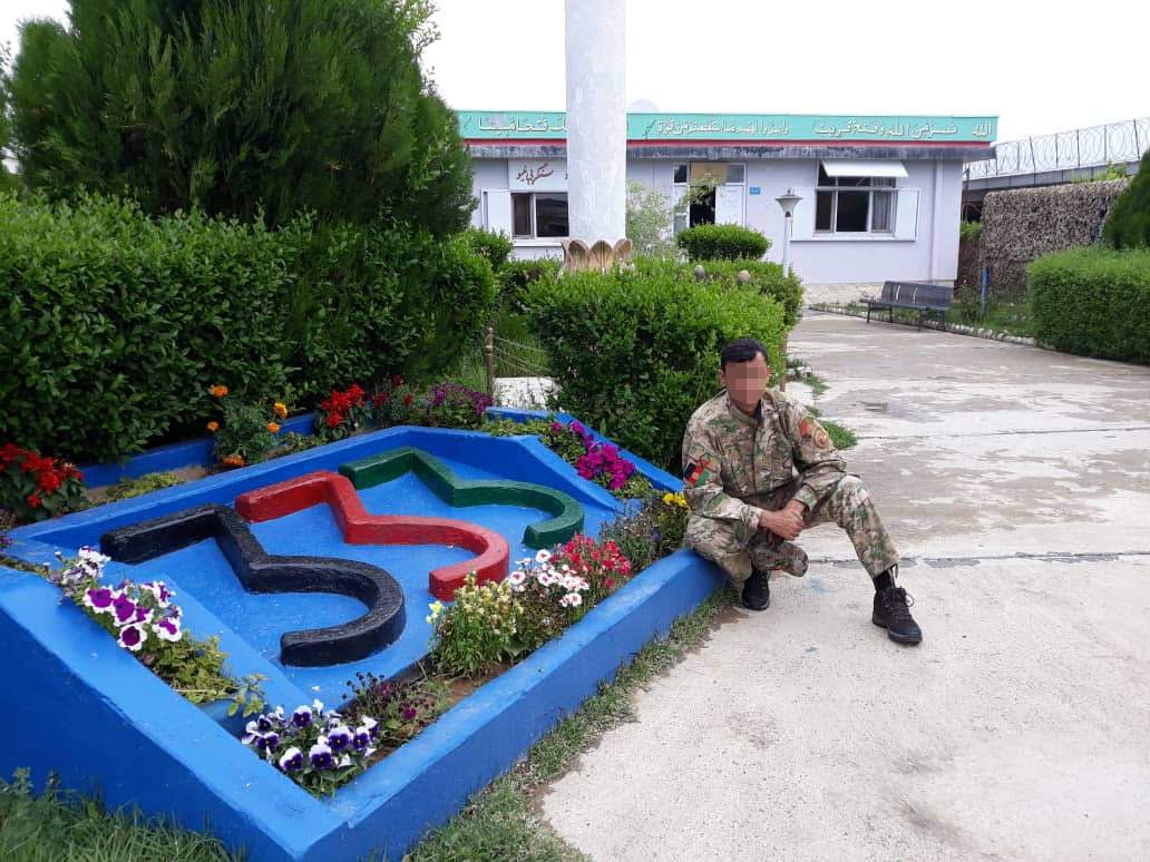 An Afghan special forces soldier next to the 333 sign at their base in Logar province, Afghanistan