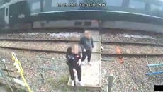 Children push each other as train speeds past on level crossing in shocking CCTV