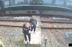 Children push each other as train speeds past on level crossing in shocking CCTV