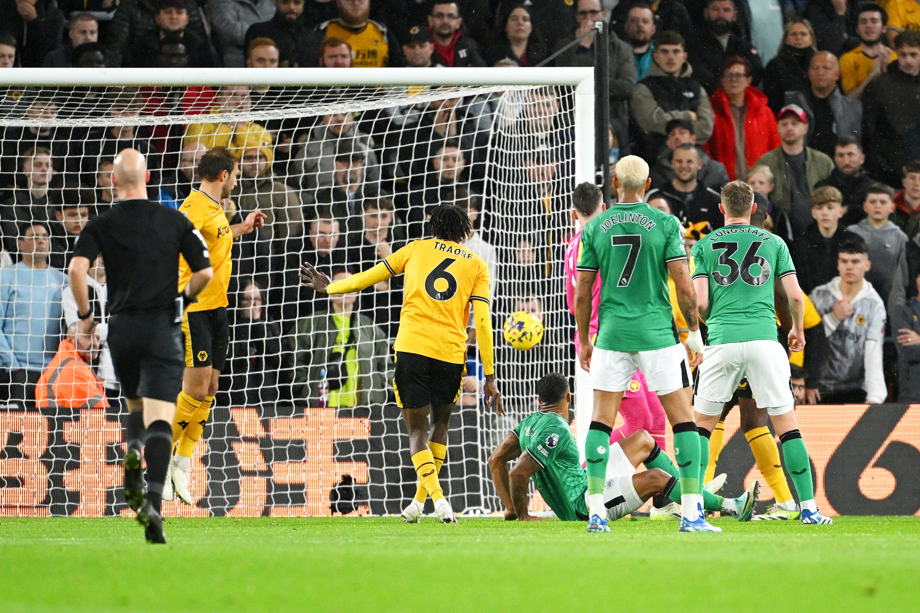 Callum Wilson watches the ball hit the net to give Newcastle the lead