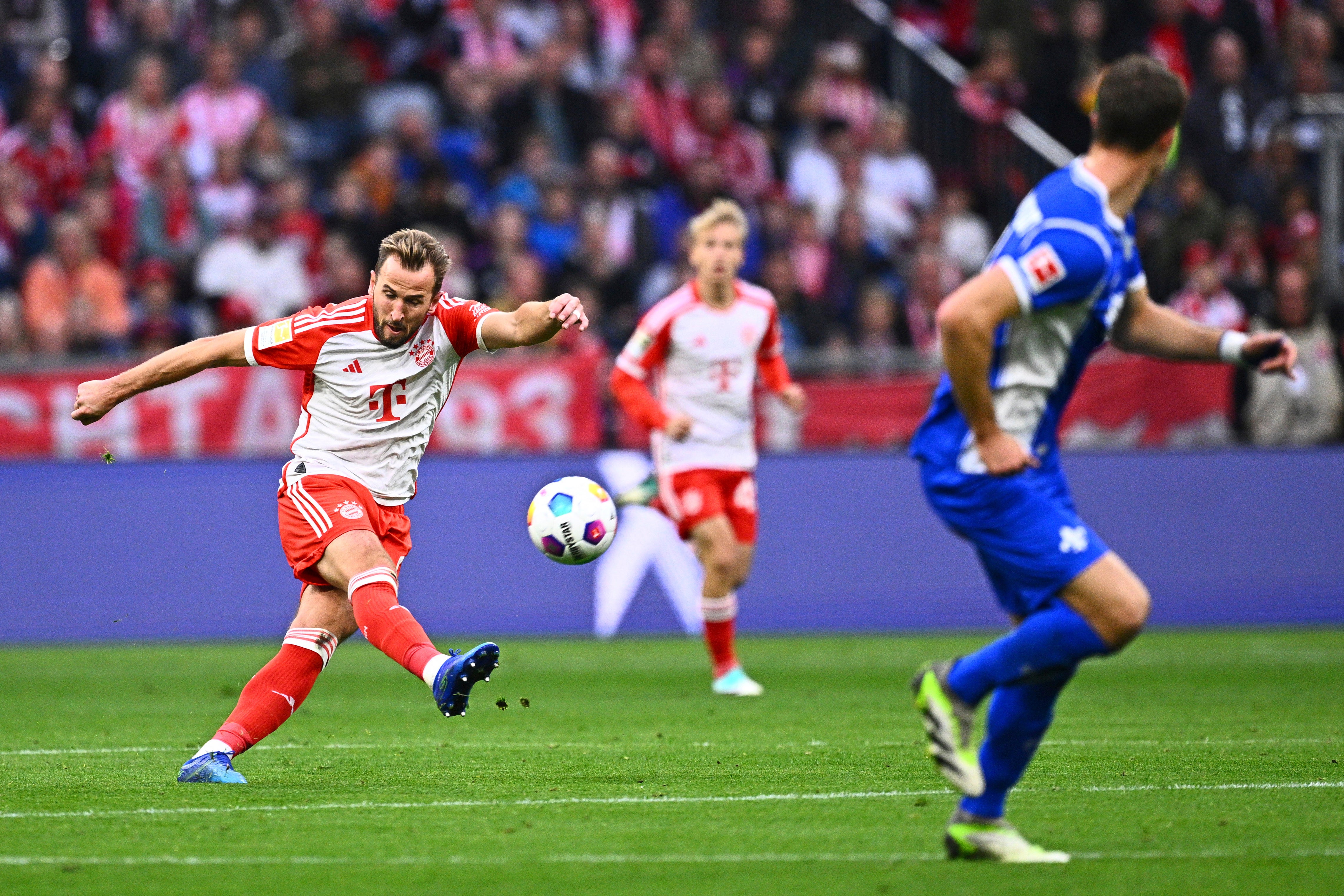 Harry Kane scores from behind the halfway line against SV Darmstadt