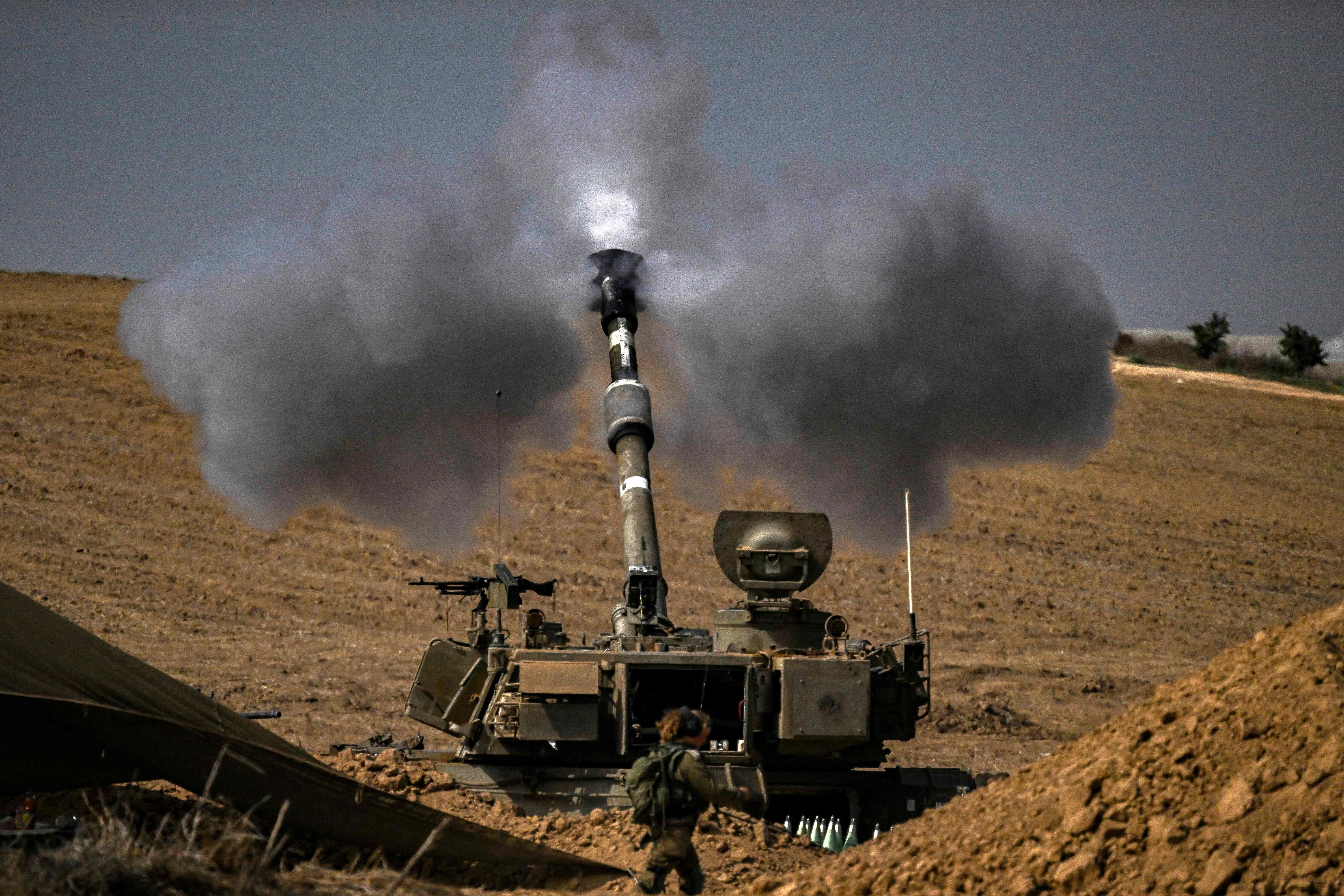 The Israeli military fires shells toward the Gaza Strip