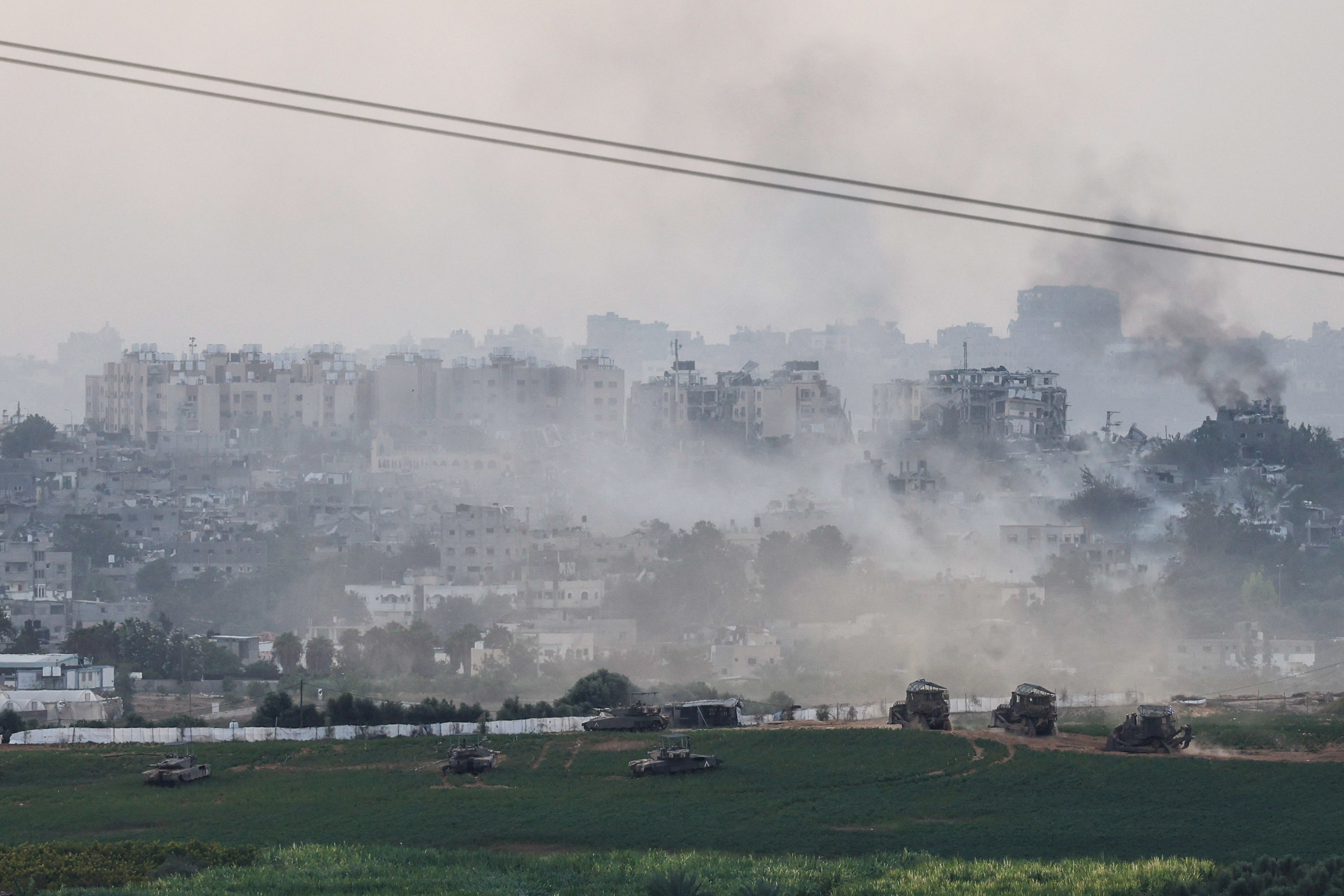 Israeli tanks and other military machines manoeuvre inside the Gaza Strip