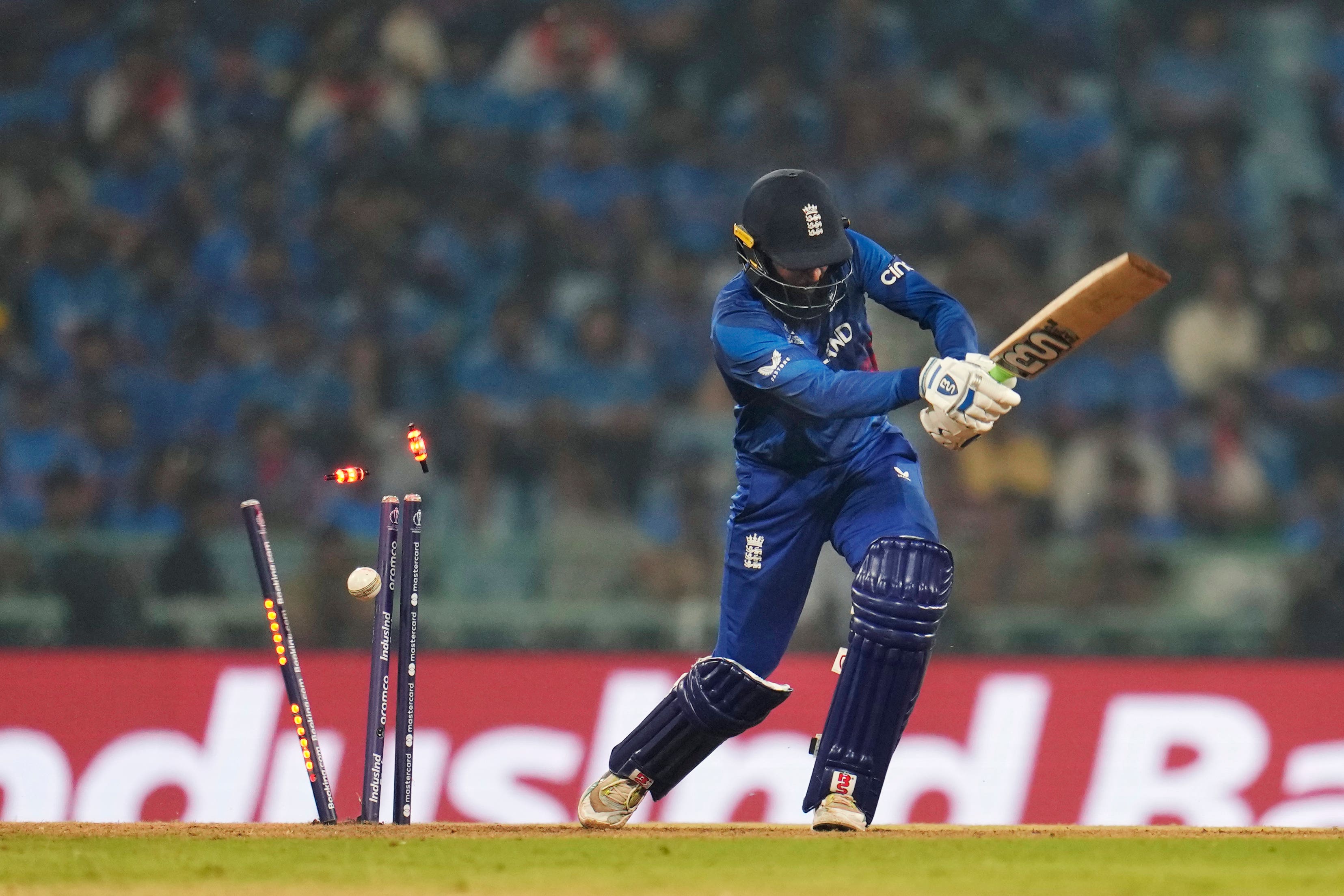 England’s Adil Rashid is bowledby India’s Mohammed Shami during in Lucknow (Aijaz Rahi/AP)