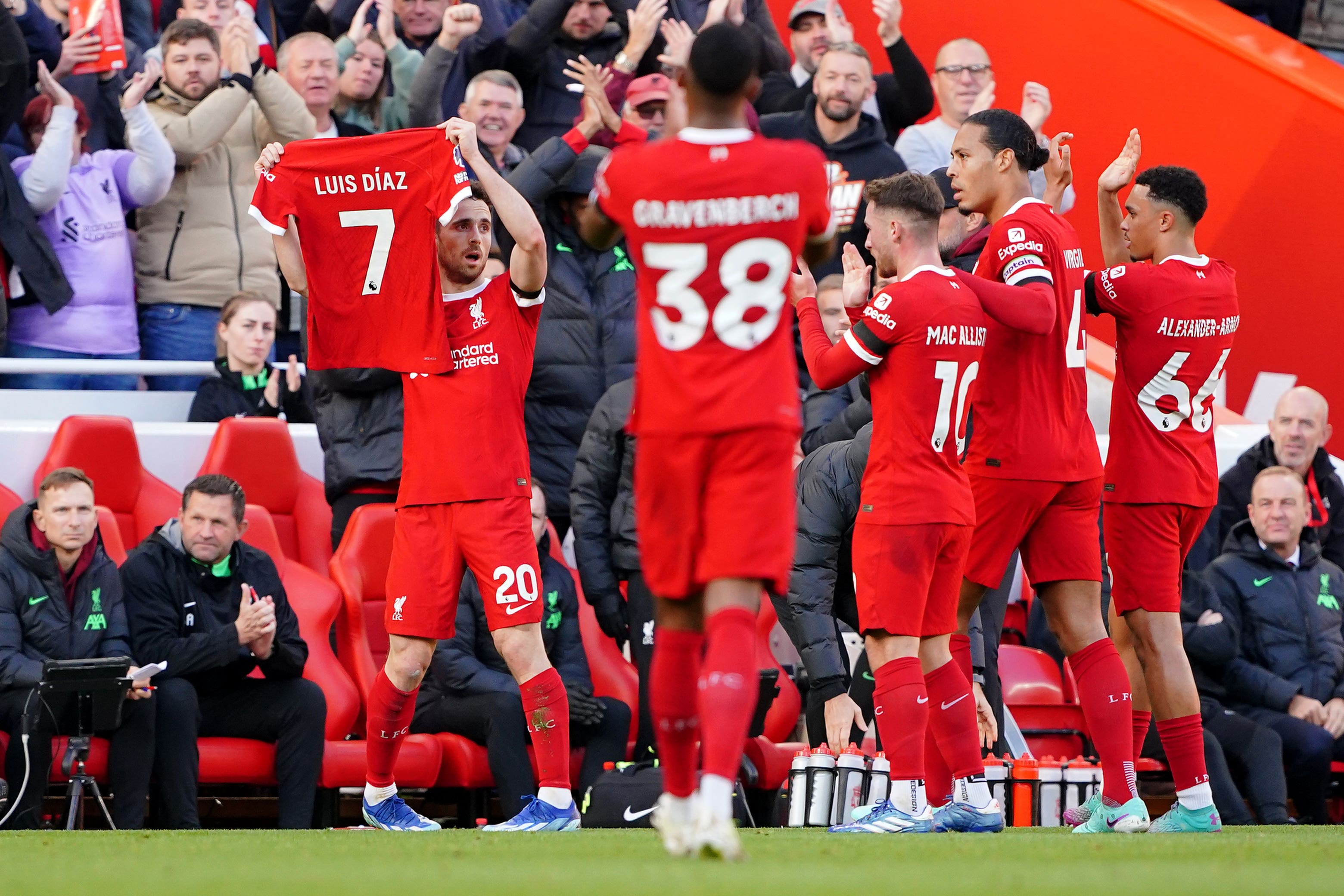 Diogo Jota holds Luis Diaz’s shirt aloft at Anfield on Sunday