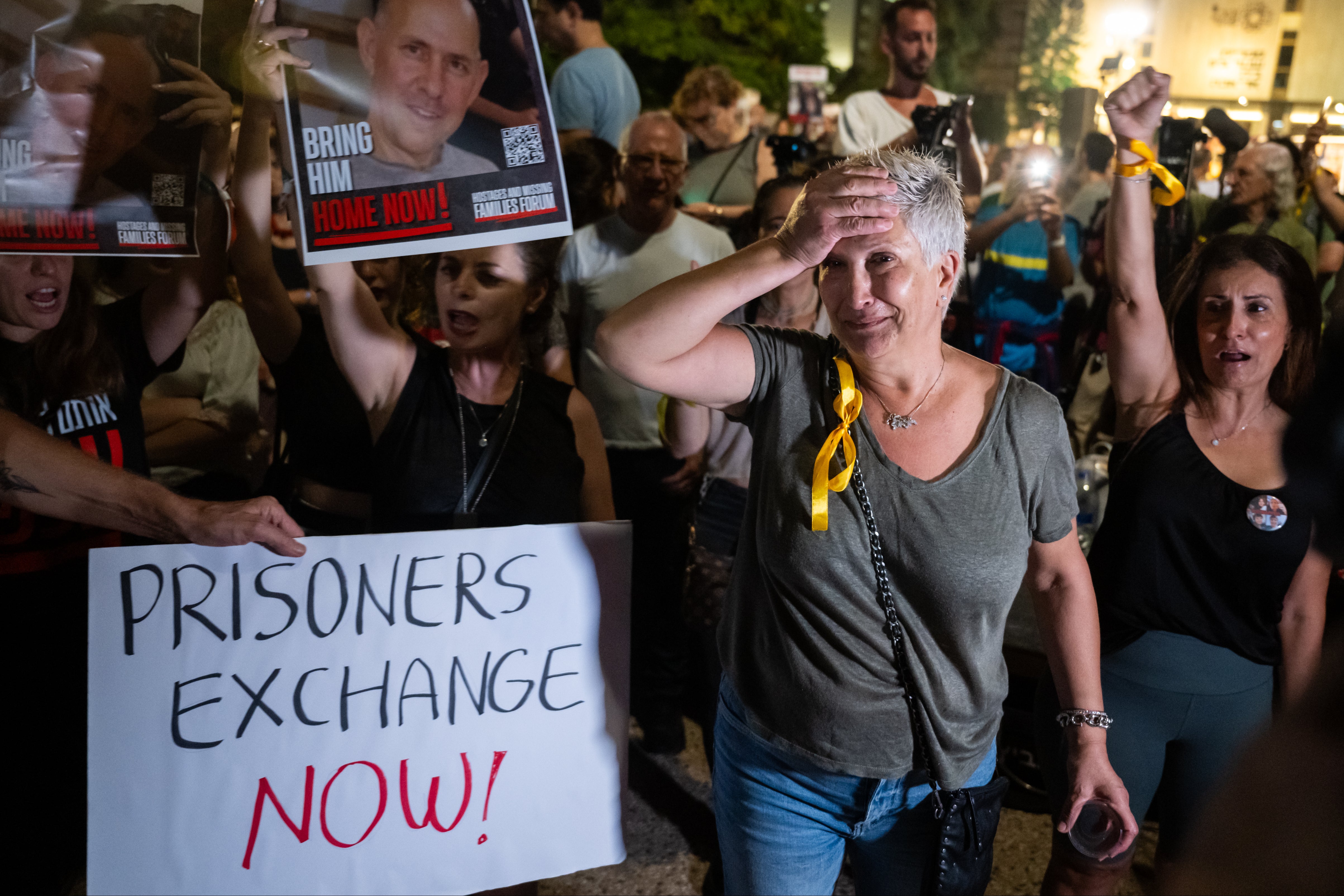 A relative of a hostage reacts during a rally calling for hostages to be released in the Tel Aviv