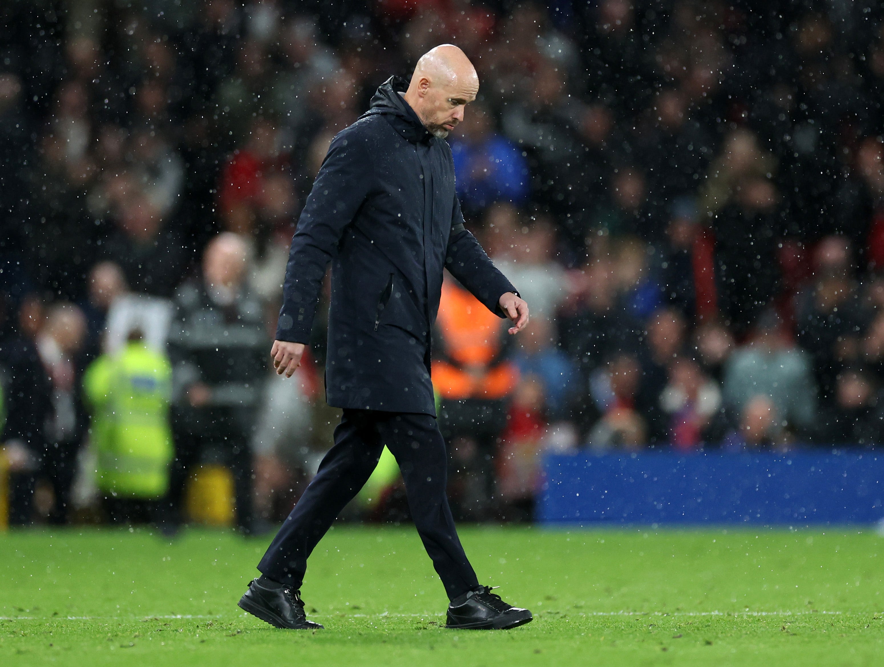 Erik Ten Hag returns to the dressing room after defeat to Manchester City in the derby