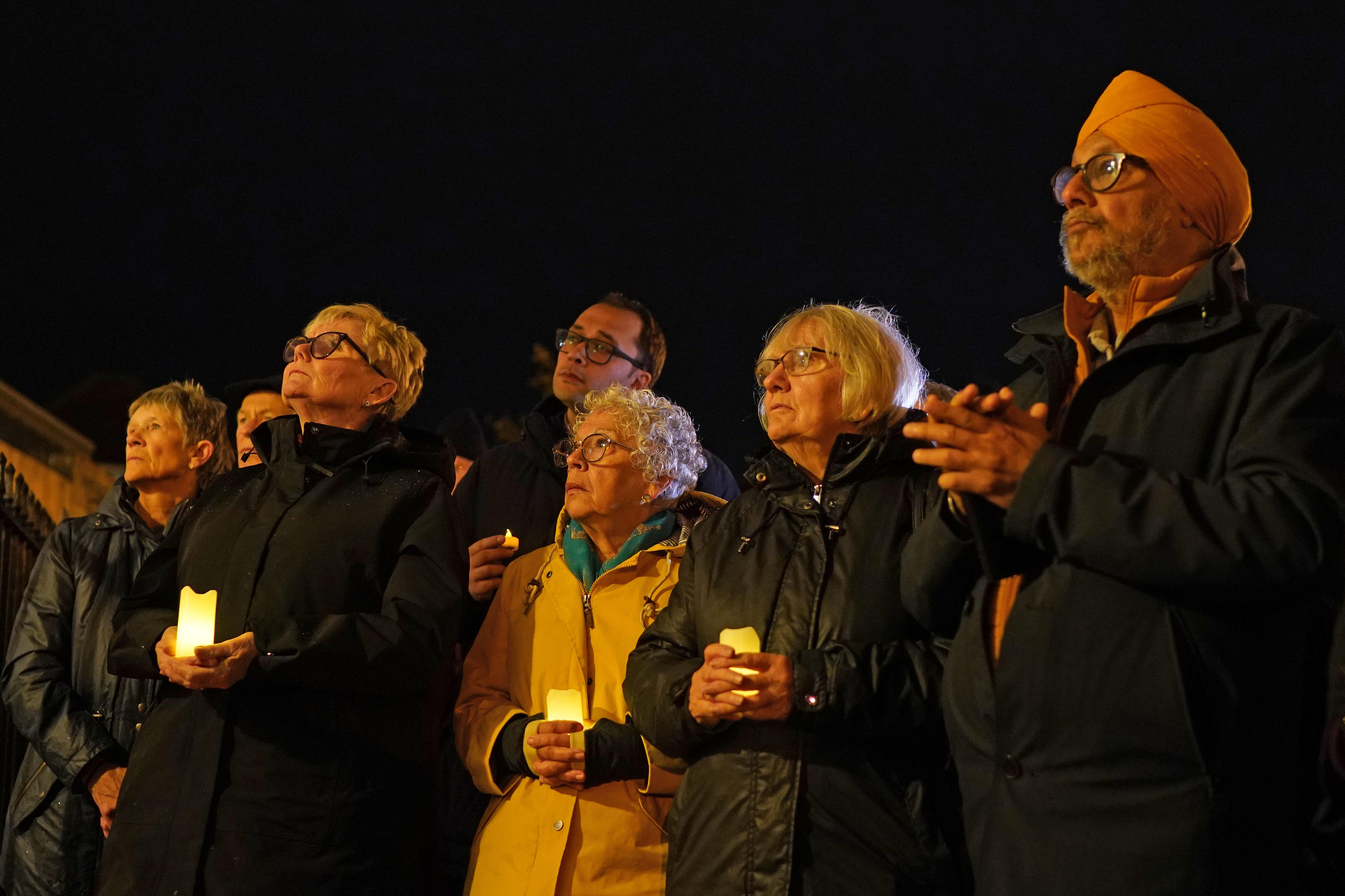 People attend a candle-lit vigil of solidarity for peace in the Middle East, at Canterbury Cathedral (Gareth Fuller/PA)