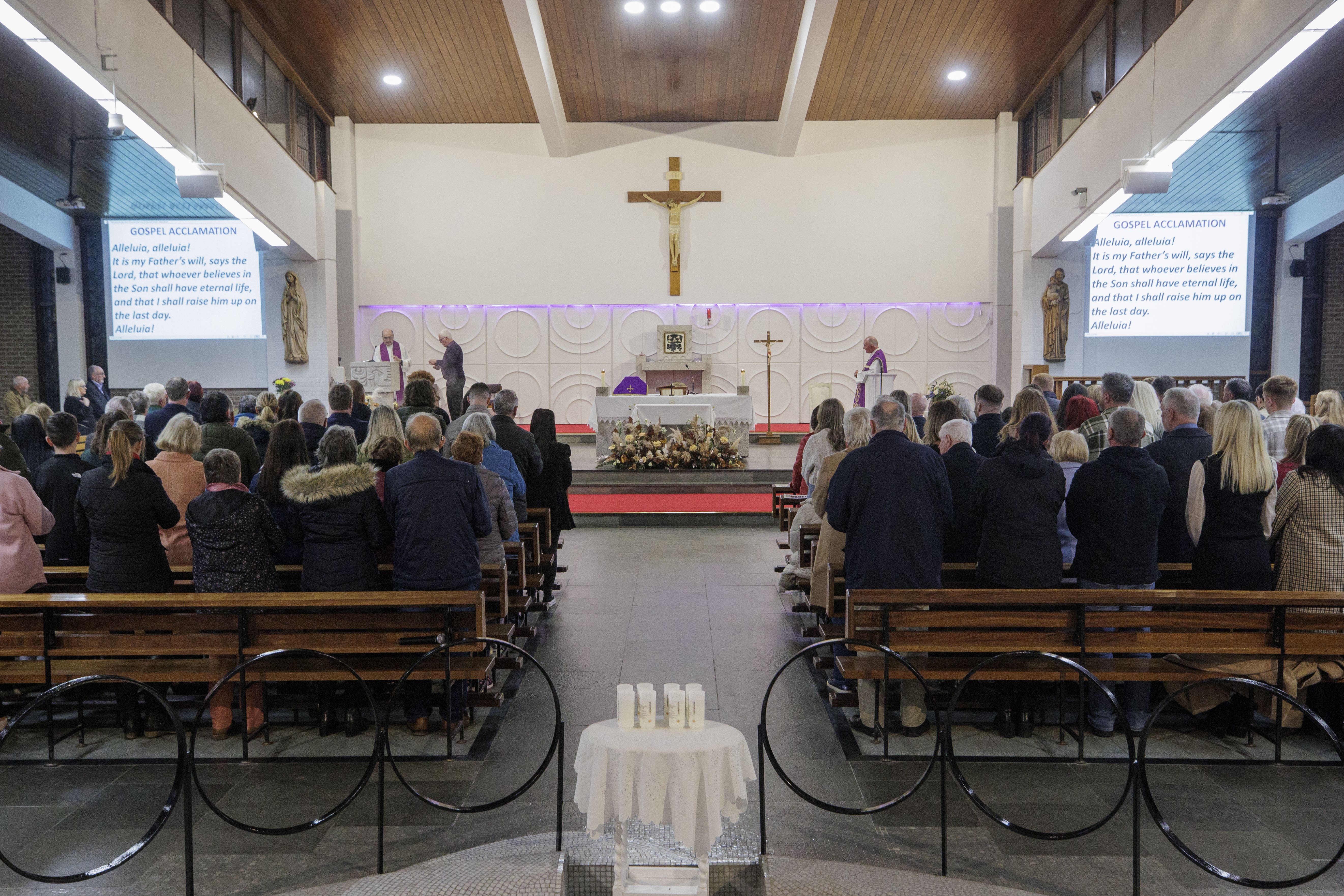 People at a service to mark the 30th anniversary of the Greysteel shooting, at the Star of the Sea Church in Greysteel, Co Londonderry. Eight people were killed and nineteen wounded by loyalists during a Halloween party at the Rising Sun Bar on October 30, 1993. Picture date: Monday October 30, 2023.