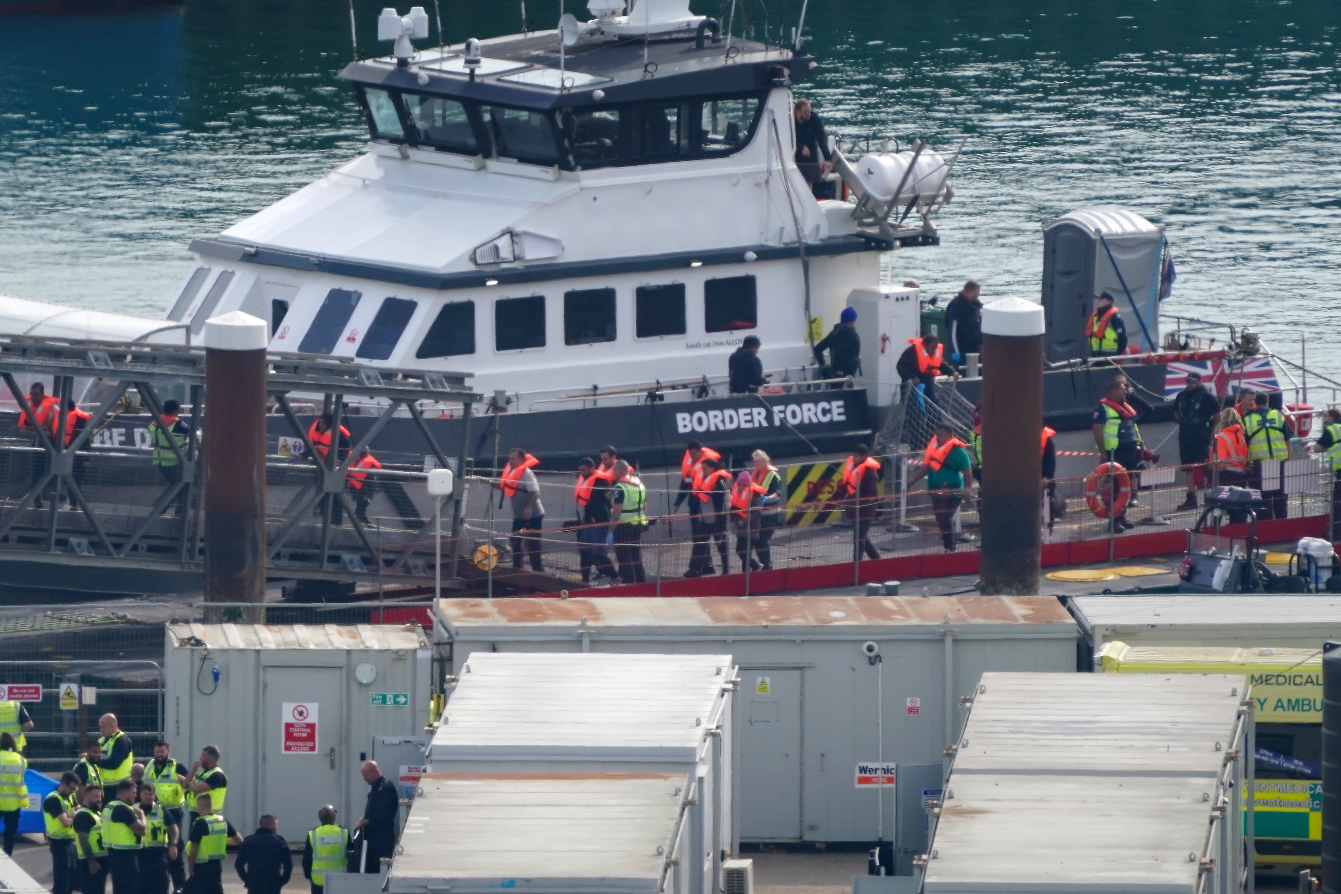 A group of people thought to be migrants are brought in to Dover, Kent, on board a Border Force vessel (Gareth Fuller/PA)