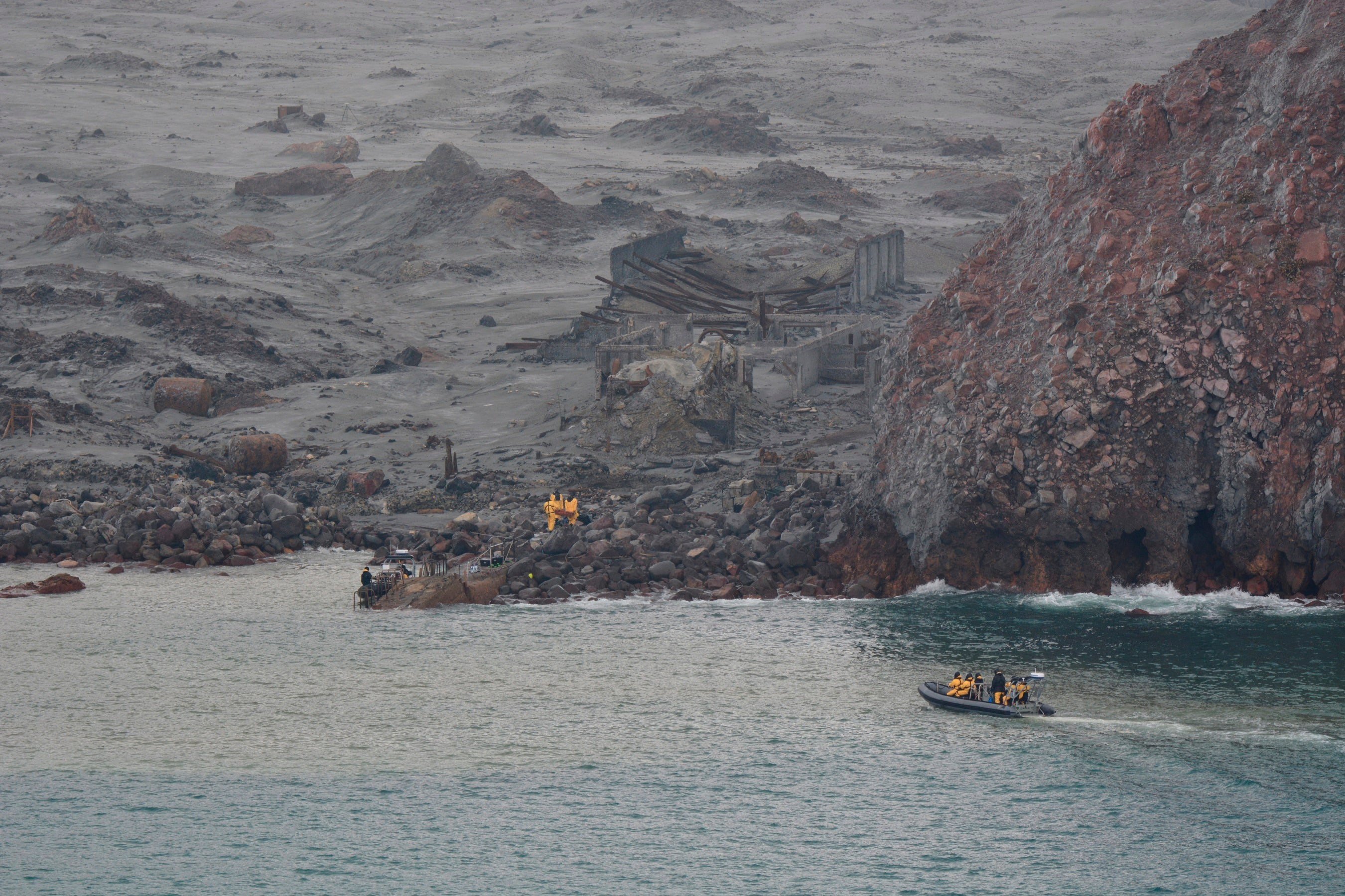 Emergency workers recover bodies from White Island on Dec. 13, 2019, after a volcanic eruption in Whakatane, New Zealand