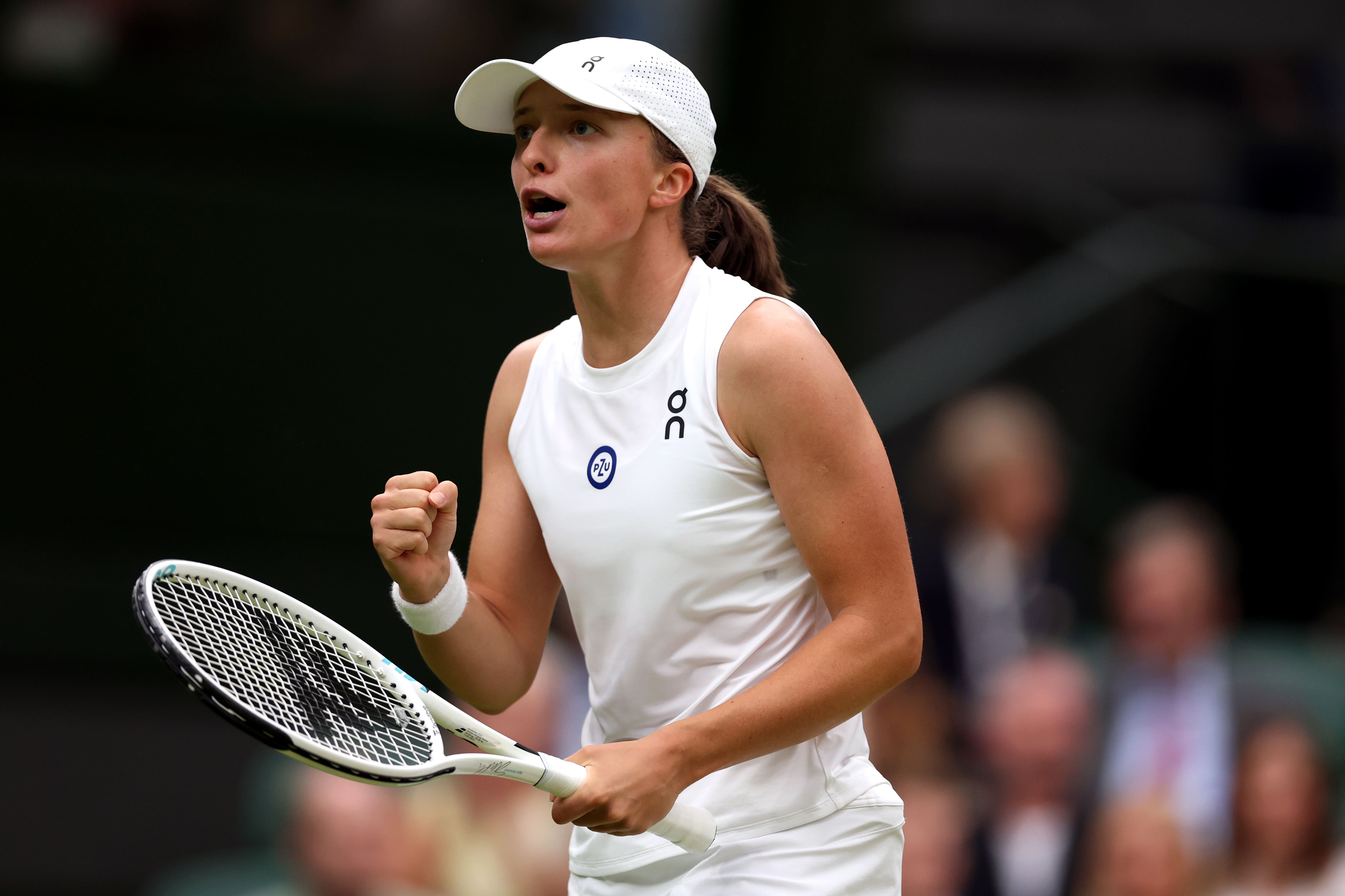 Iga Swiatek reacts during the ladies quarter finals in Wimbledon 2023 (Steven Paston/AP)