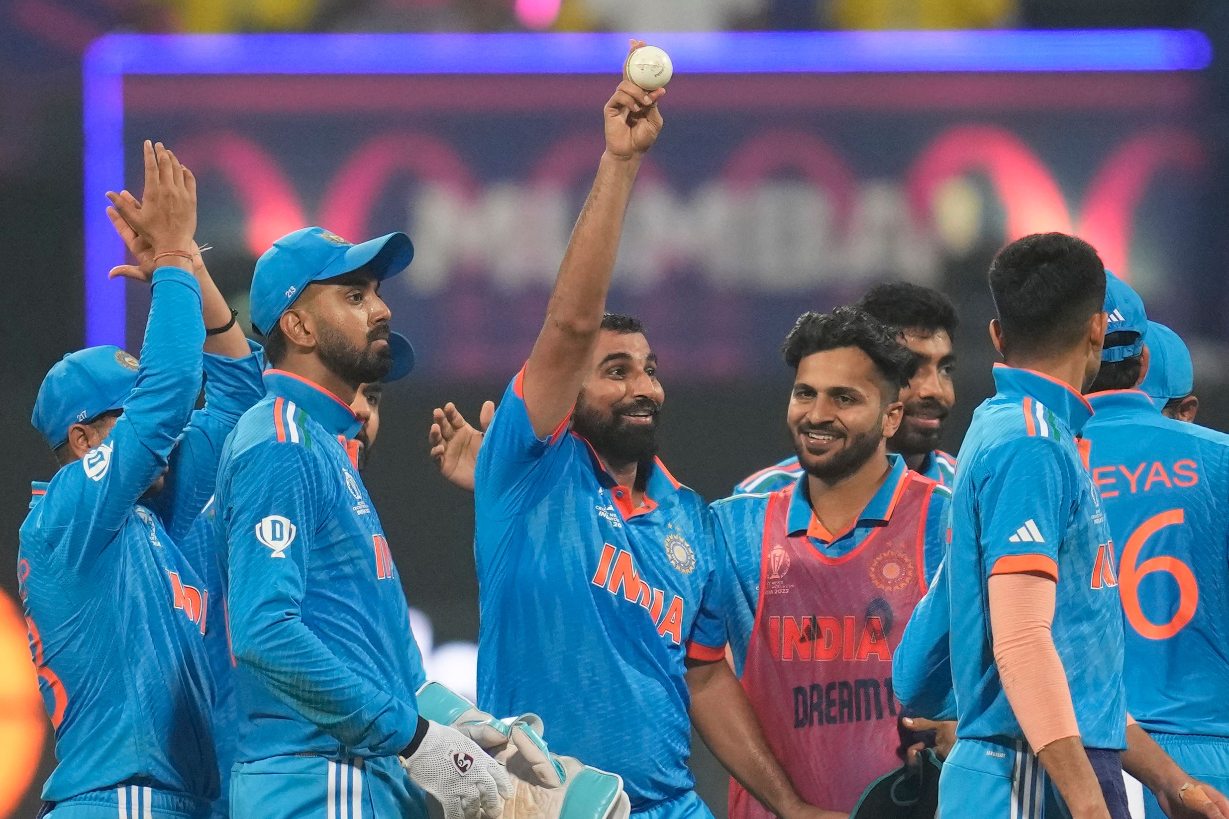 Mohammed Shami, centre, celebrates his five-wicket haul (Rafiq Maqbool/AP)