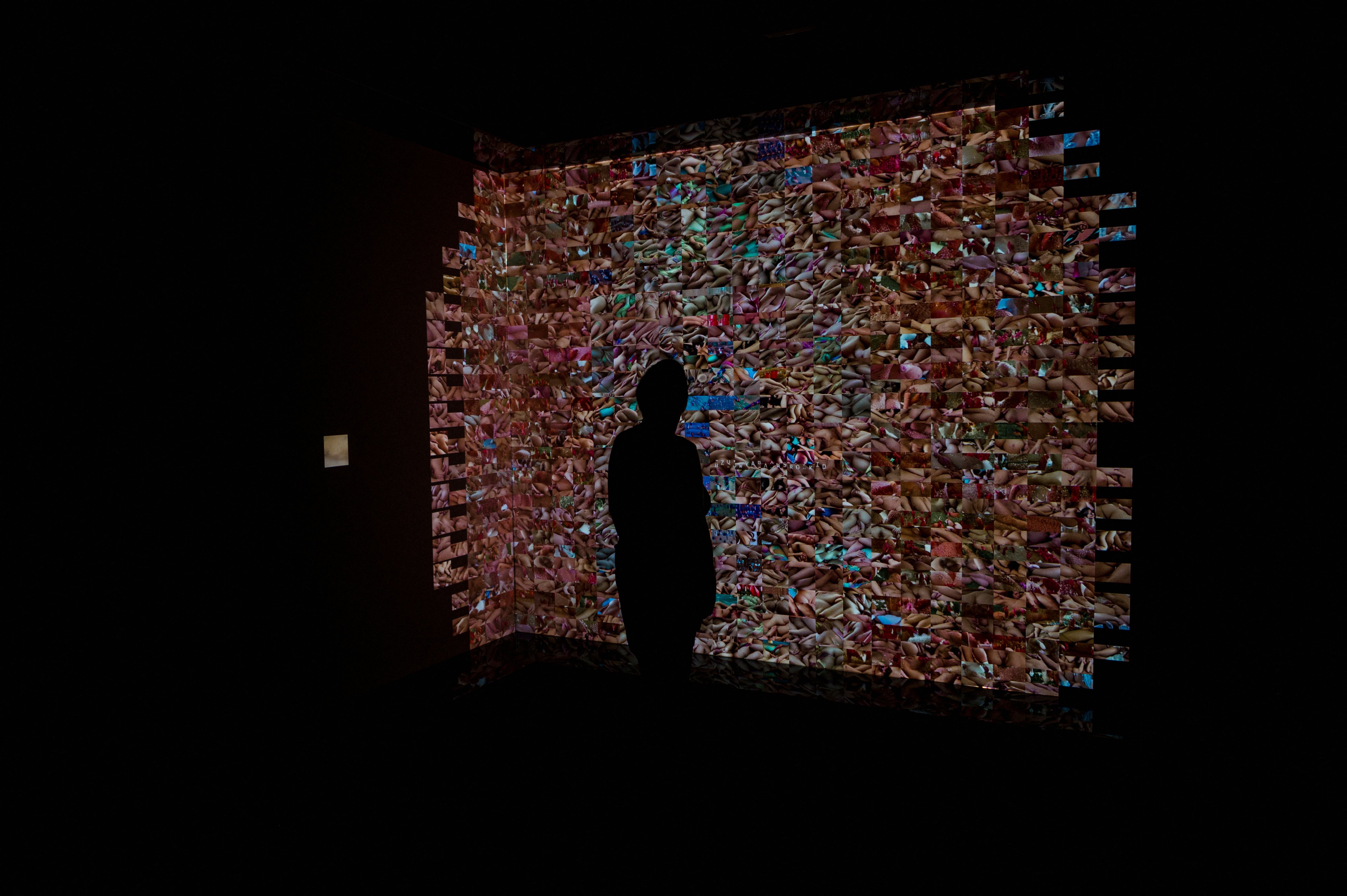 A visitor walks through the artificial intelligence exhibition ‘Sex, Desire and Data’ at the Centre Phi in Montreal, Quebec, Canada