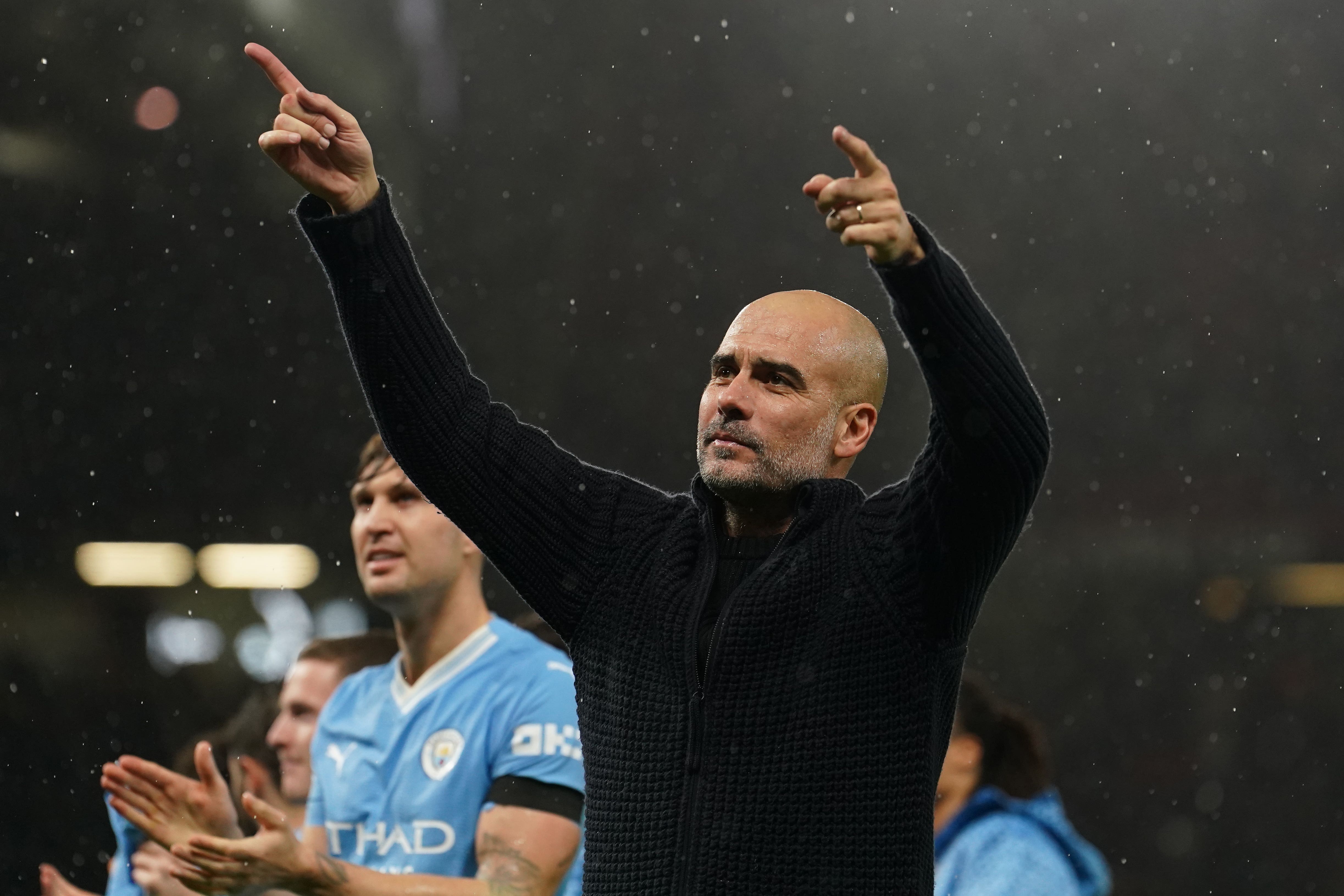 Pep Guardiola spoke to Erling Haaland on the pitch at Old Trafford (Martin Rickett/PA)