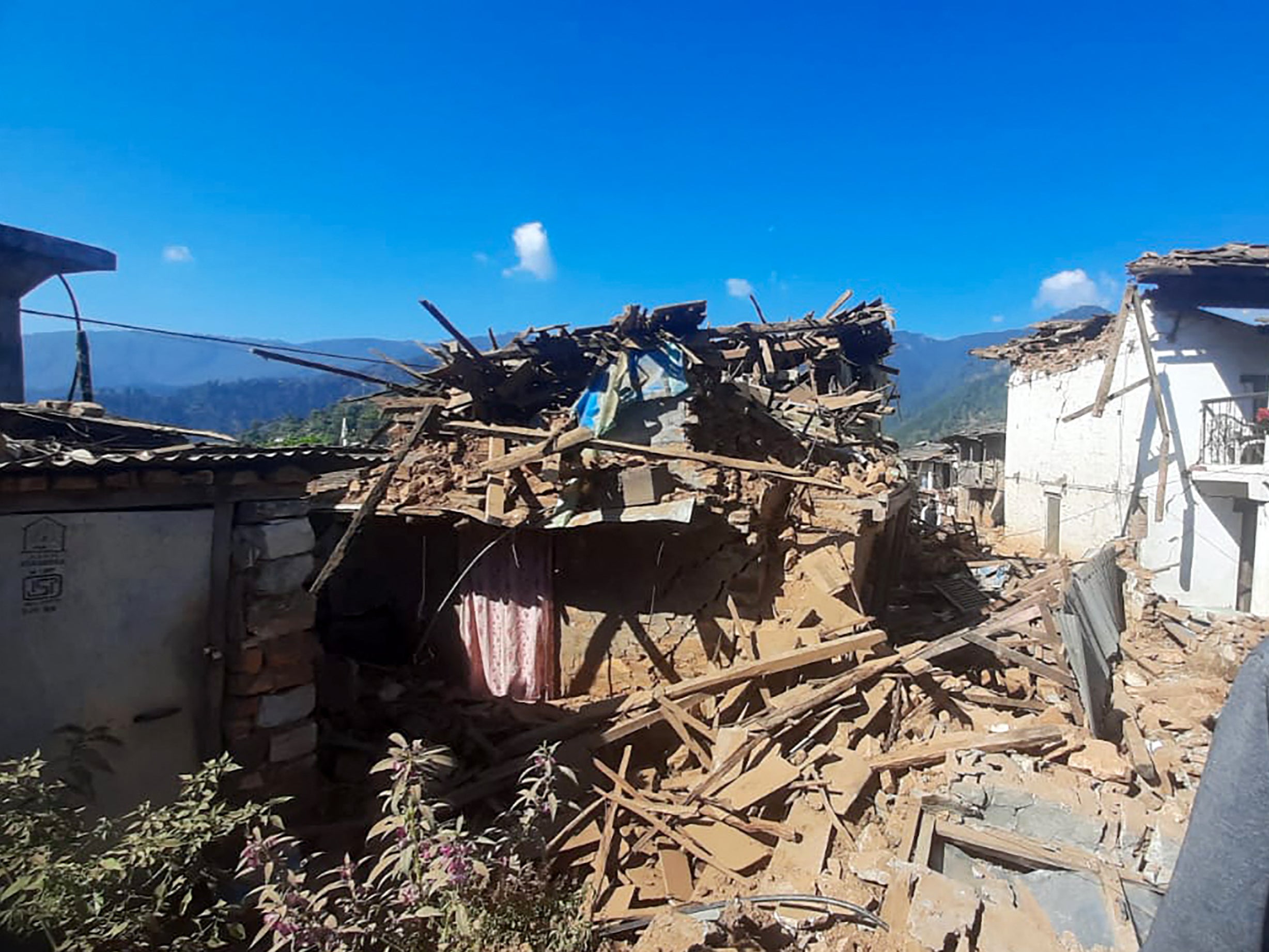 Damaged houses lie in ruins, in the aftermath of an earthquake in Jajarkot district, Nepal on 4 November 2023