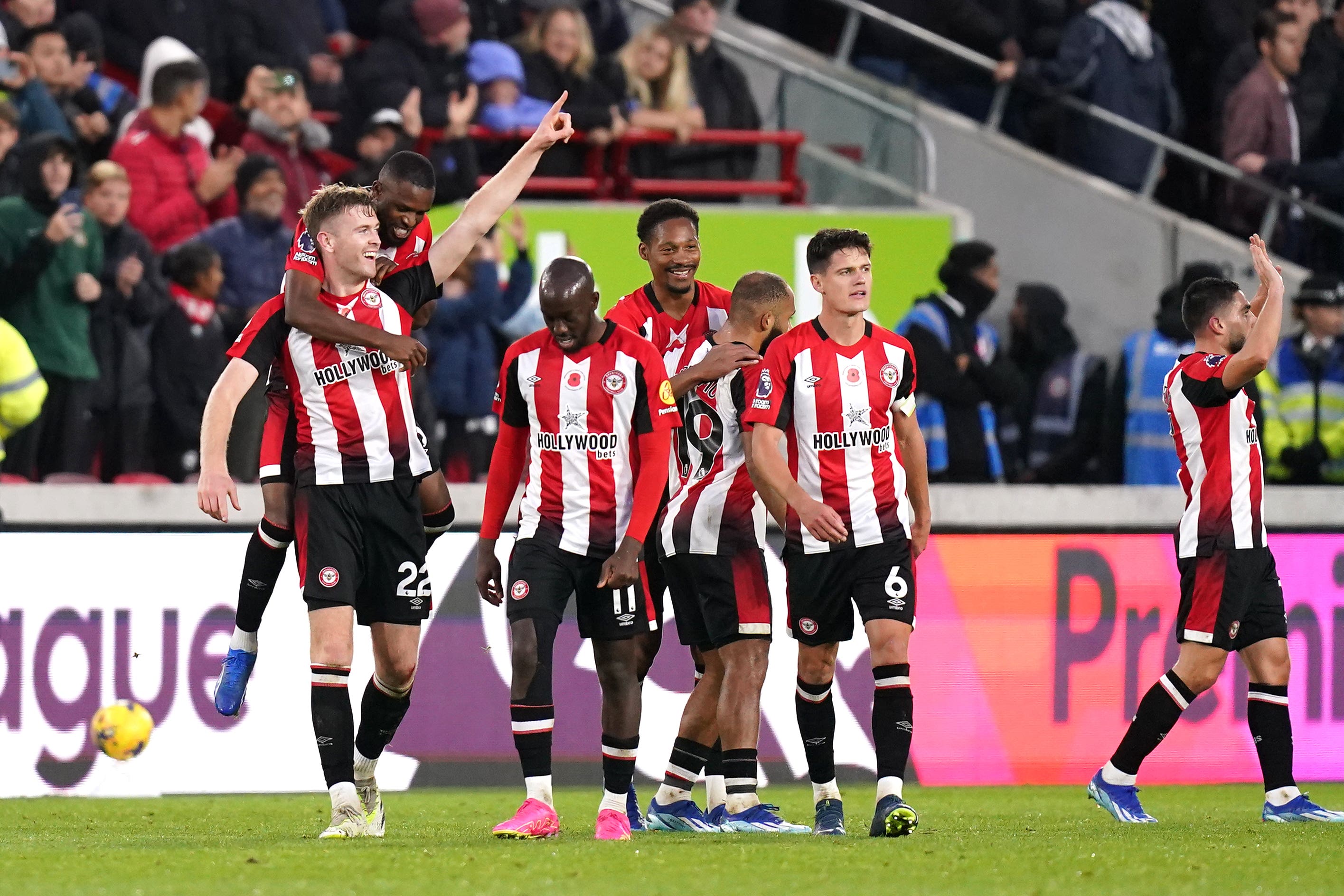 Nathan Collins, left, celebrates after scoring Brentford’s winner (John Walton/PA)