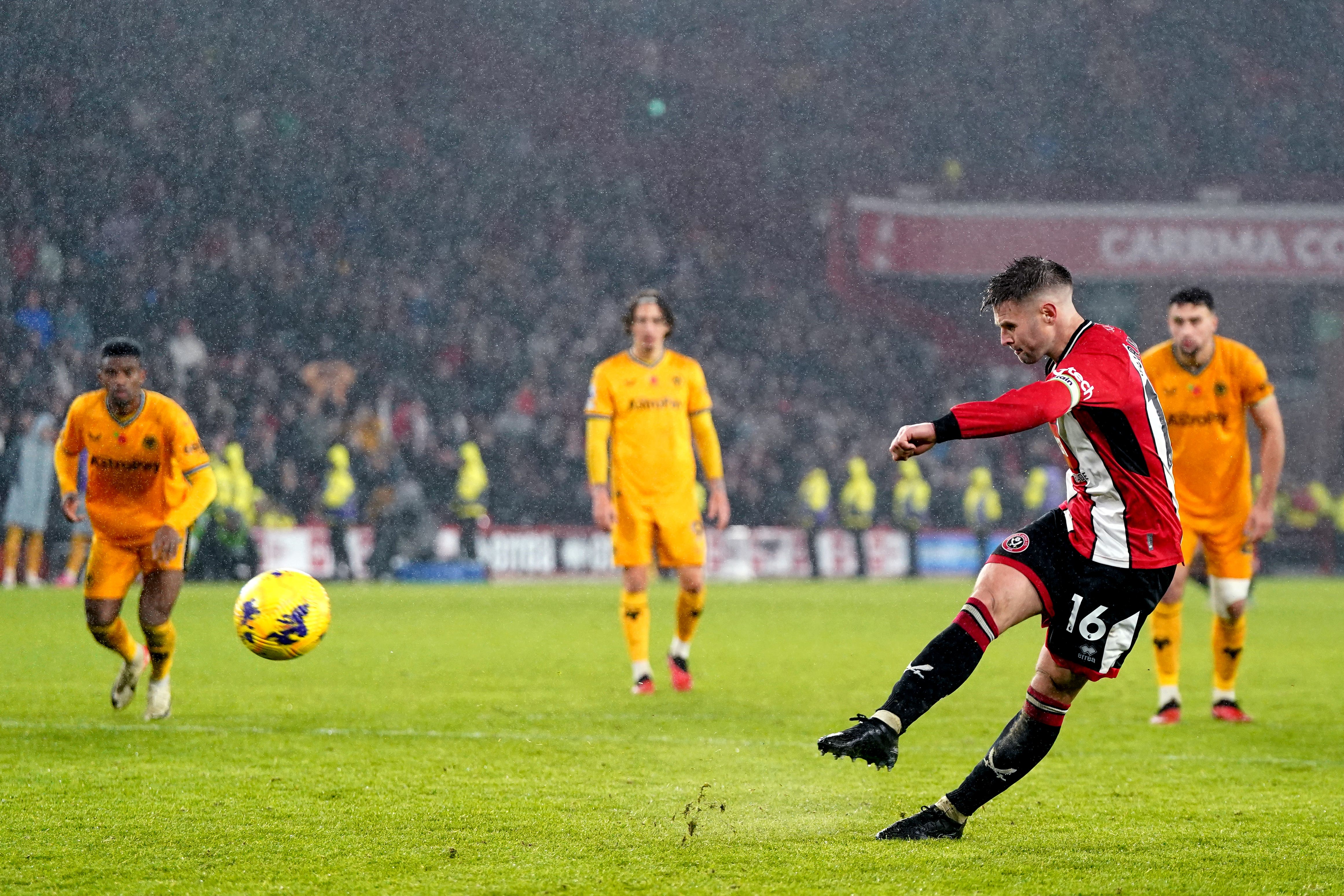 Sheffield United’s Oliver Norwood scores a stoppage-time penalty against Wolves (Nick Potts/PA)