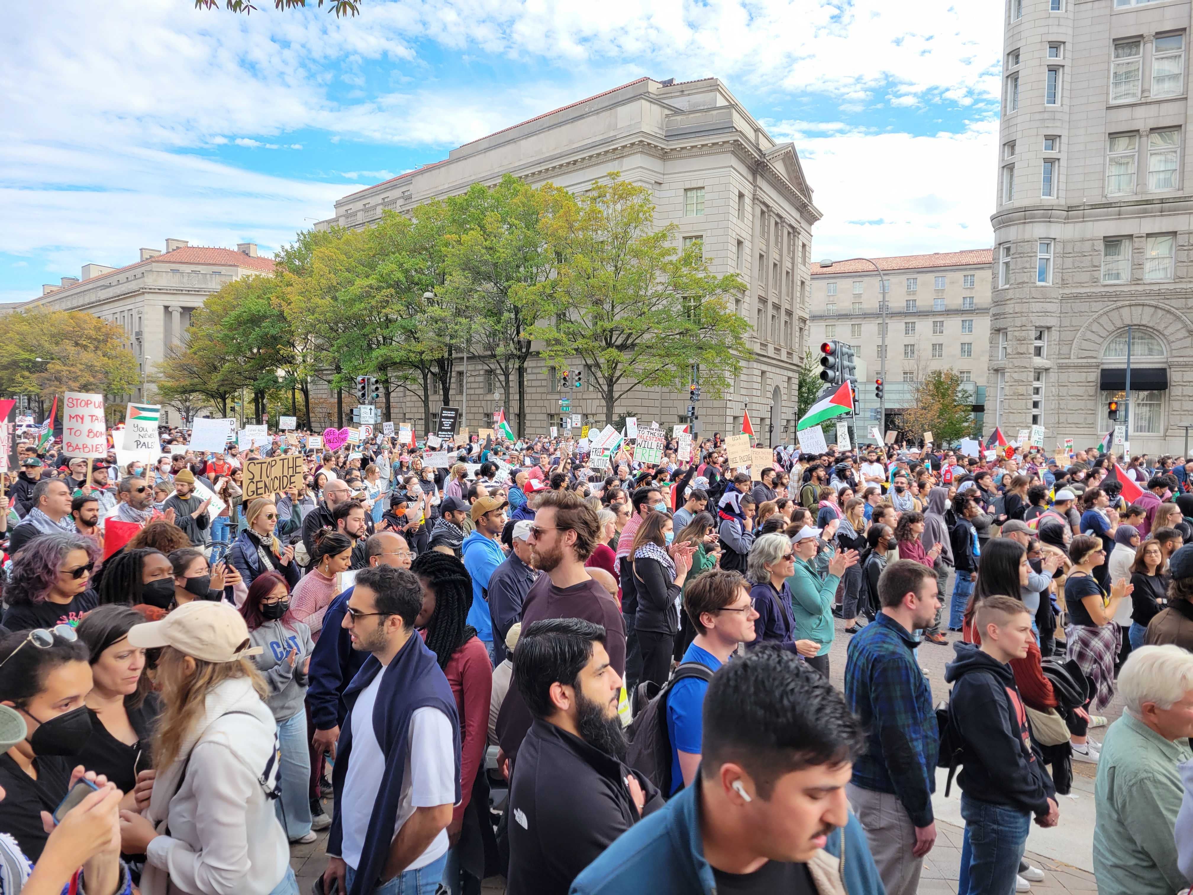 Rally attendees listen to a speech in downtown Washington, DC