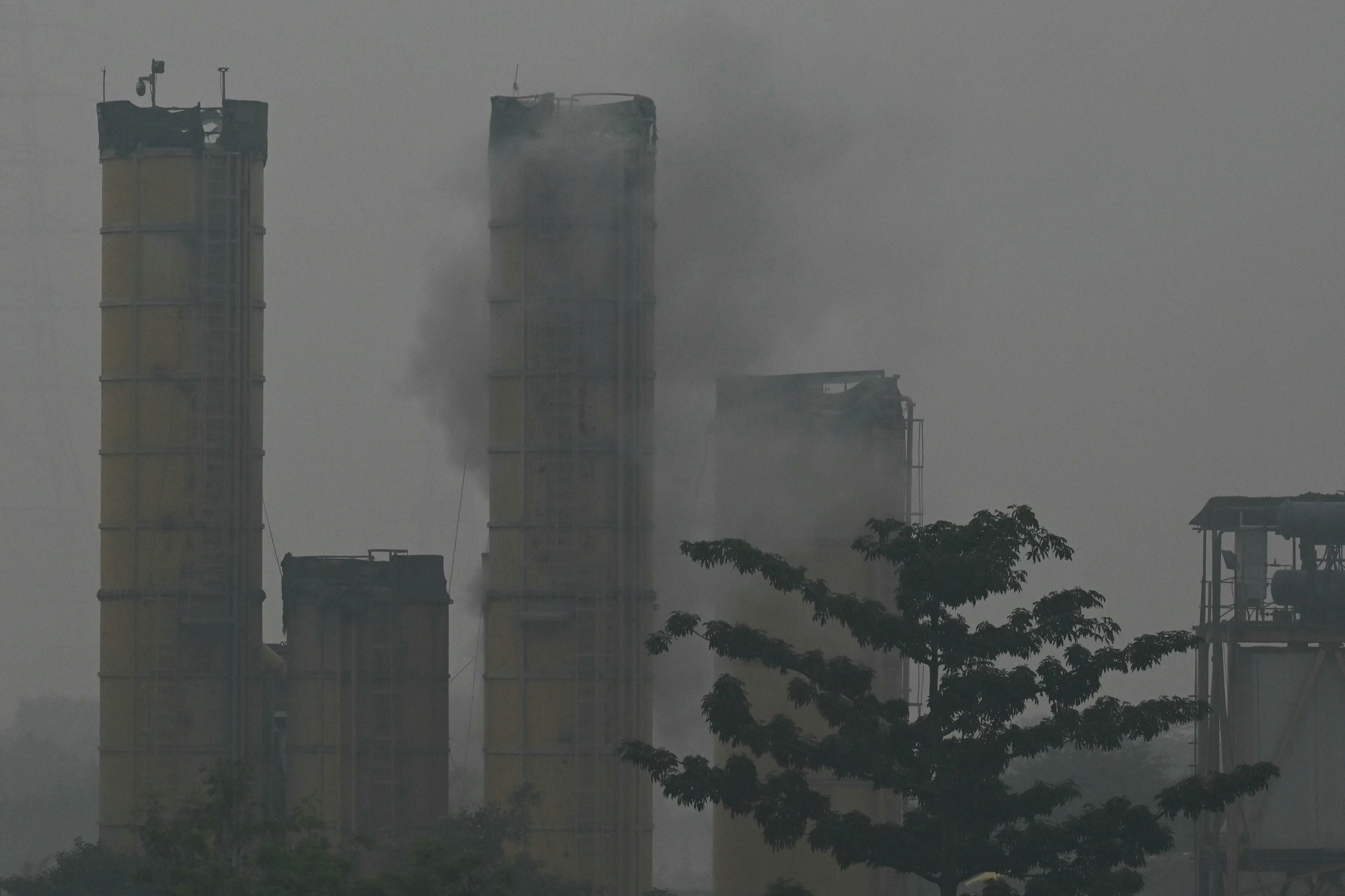 Smoke rises from a furnace at a construction site in New Delhi