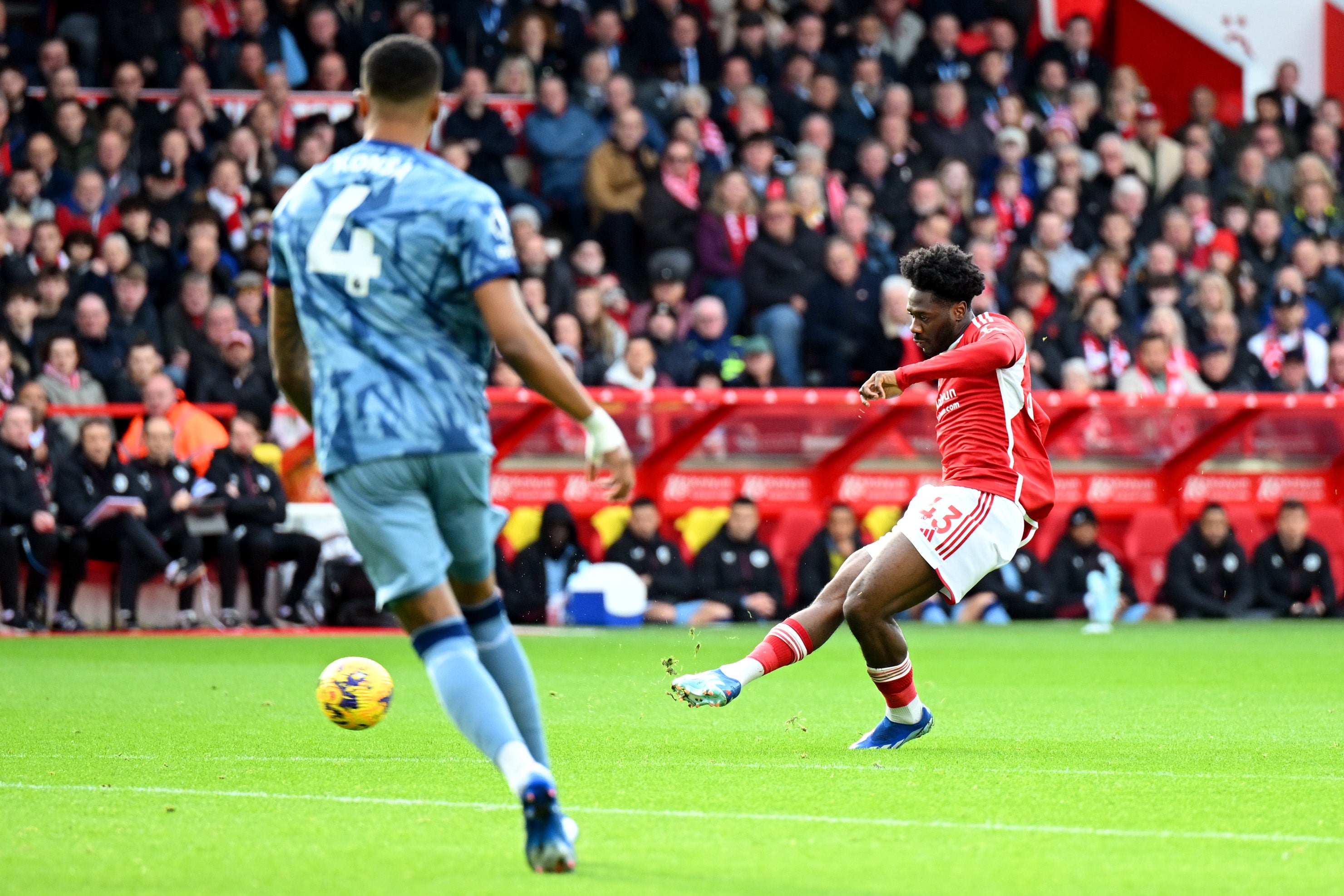 Ola Aina strokes home the opening goal at the City Ground