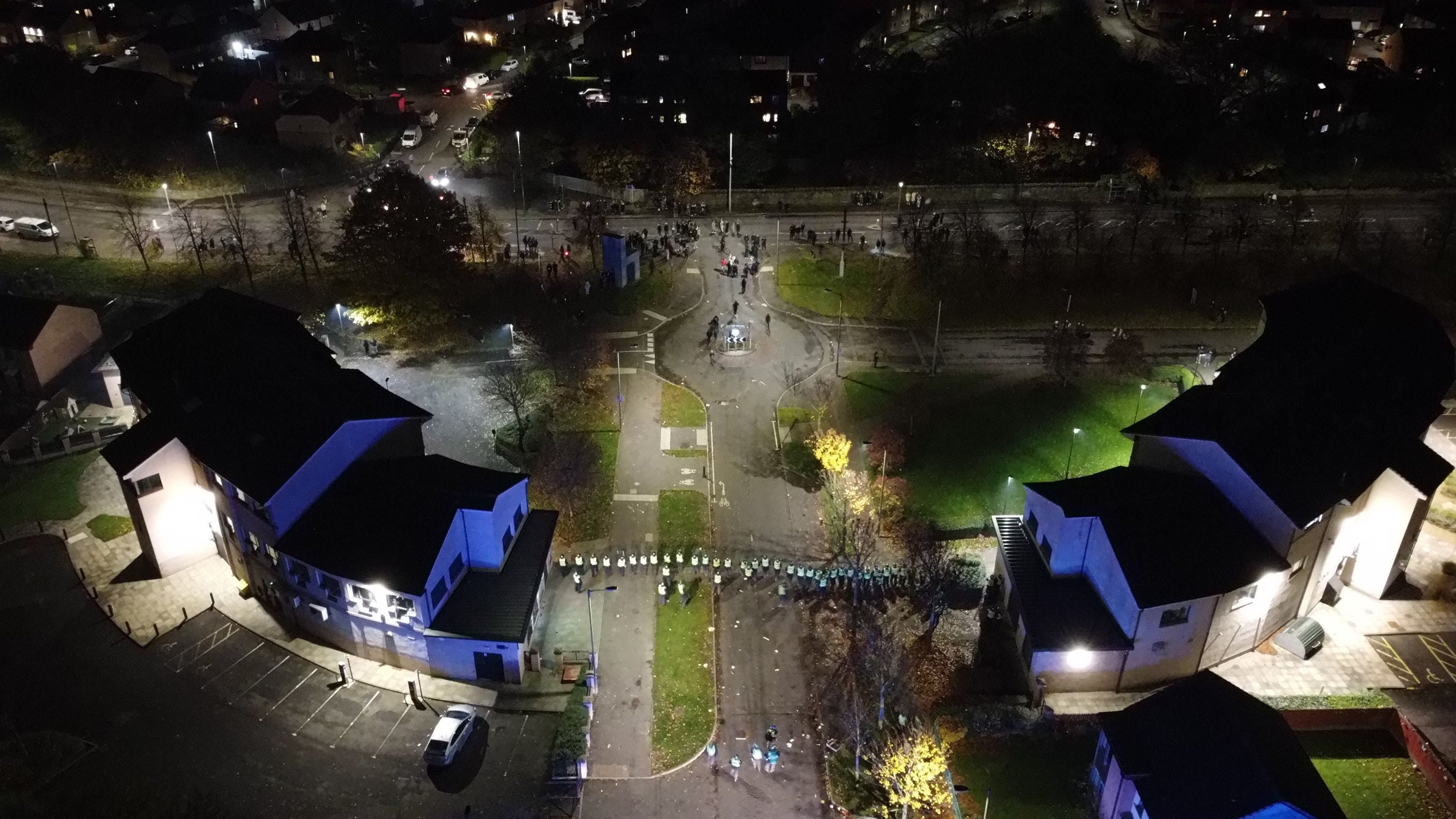 Drone footage from Niddrie shows a line of police officers with riot shields