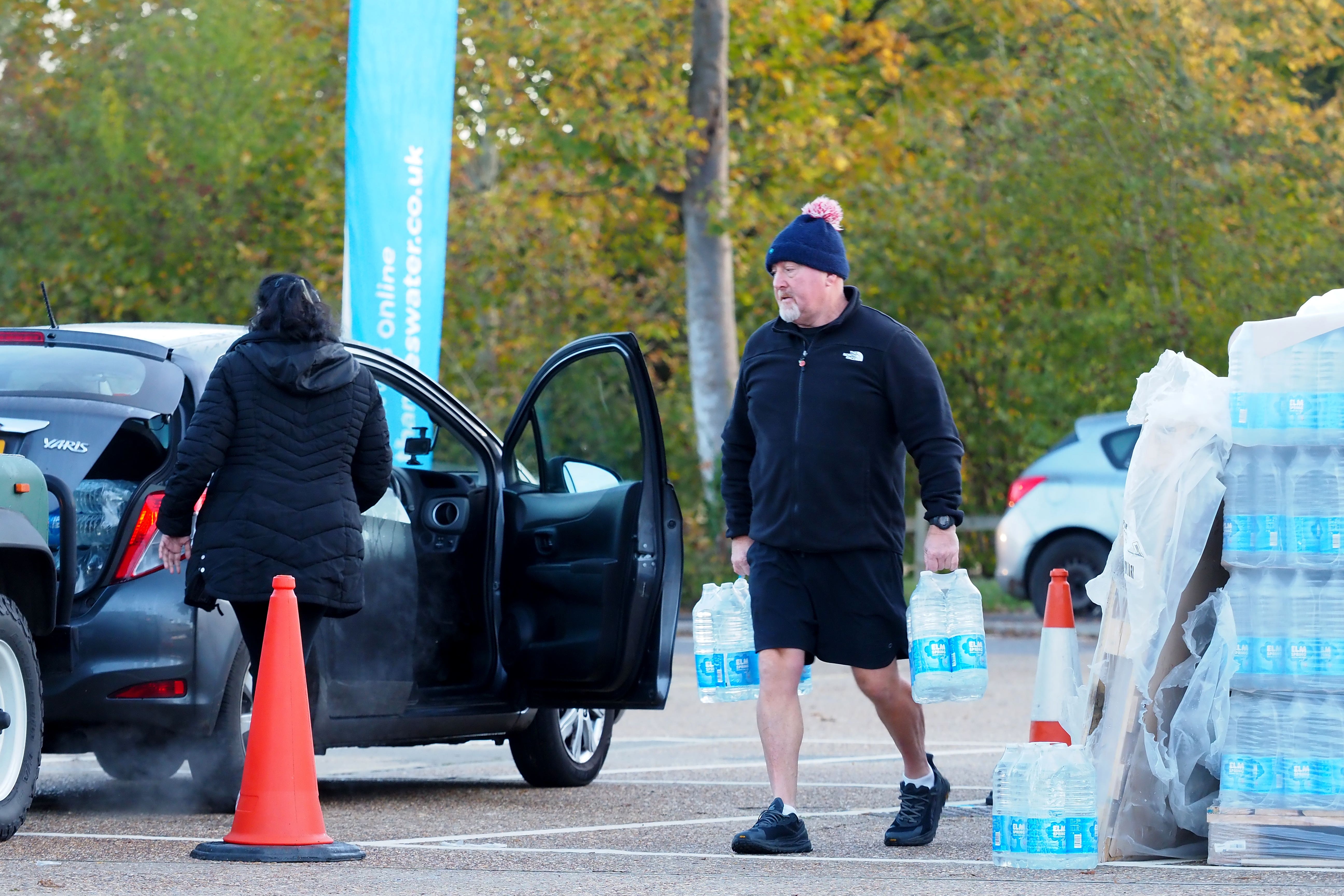 Local residents used bottled water stations on Monday (Joe Sene/PA)