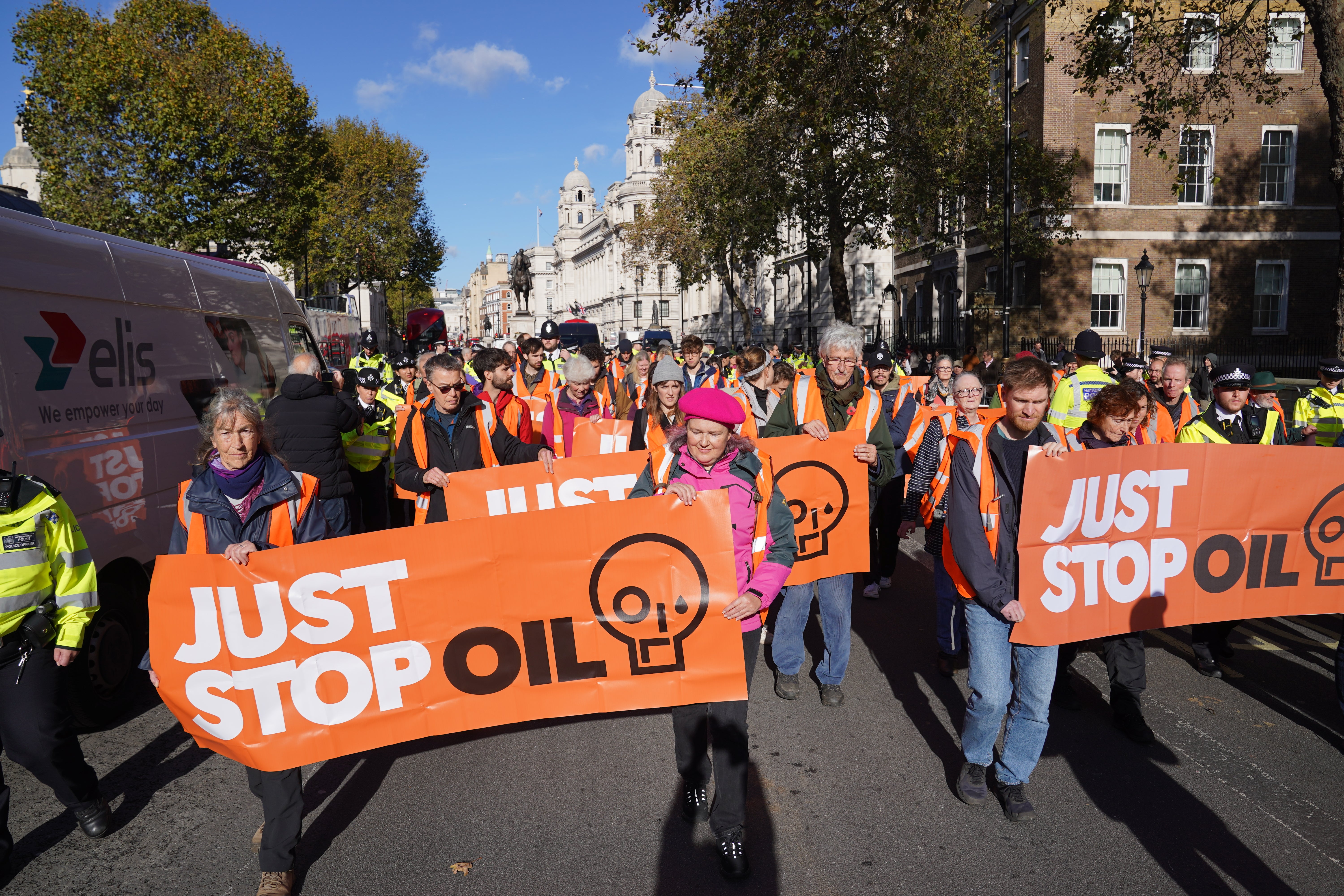 Just Stop Oil protesters take part in a walking protest blocking Whitehall in central London