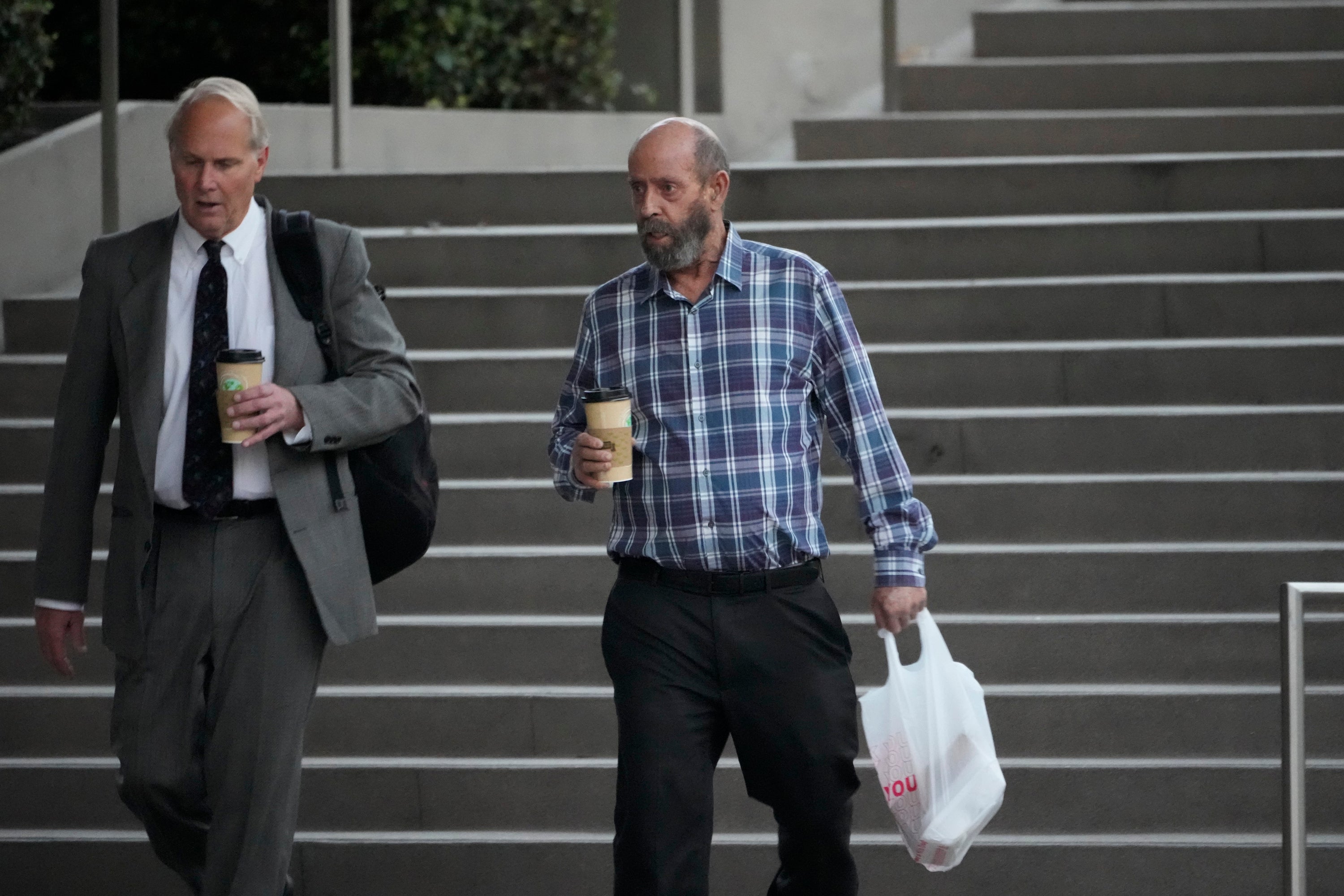 Jerry Boylan, captain of the Conception, right, arrives at federal court in Los Angeles in October
