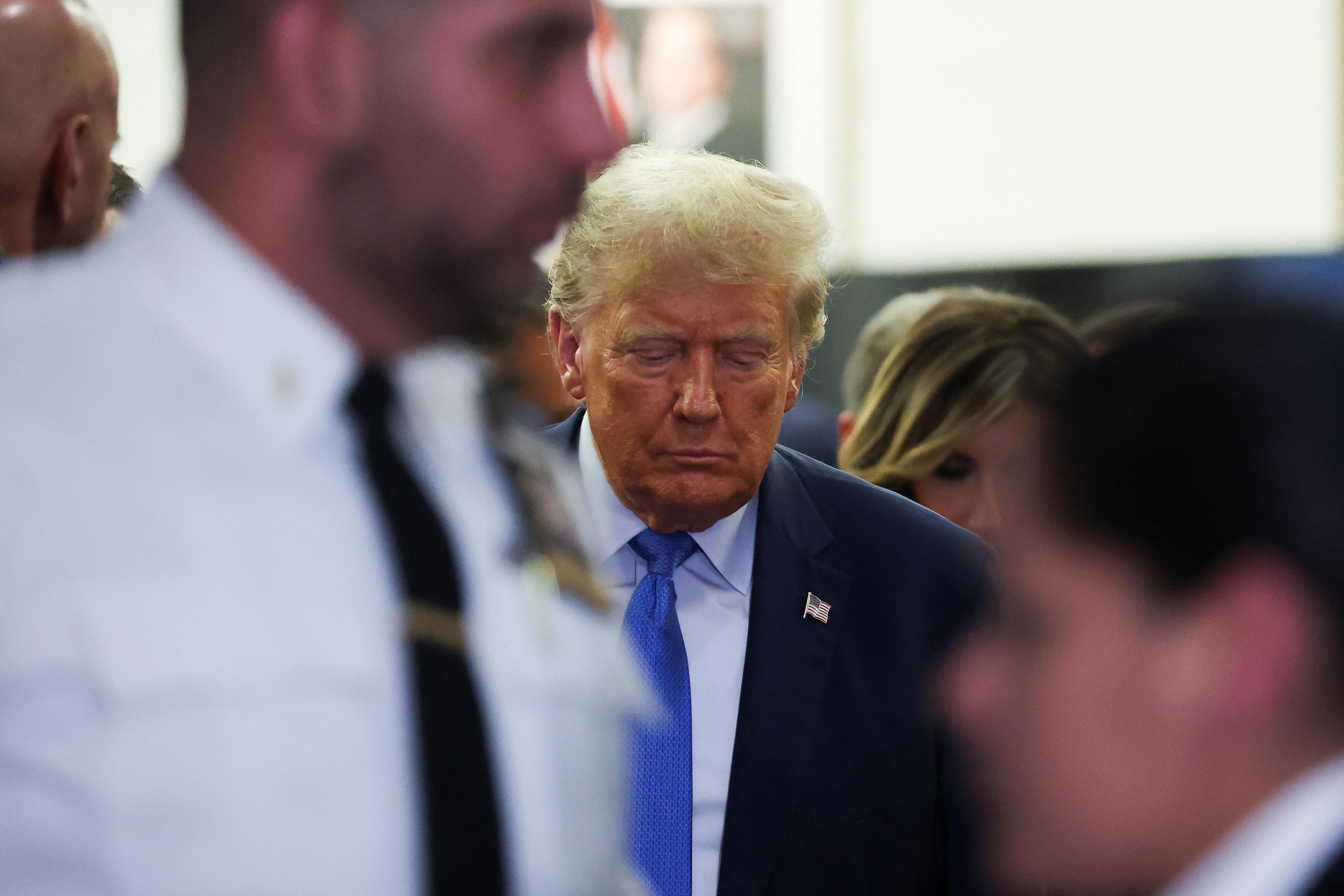 Donald Trump leaves New York Supreme Court on 6 November after testifying in a civil fraud trial case aimed at his businss empire.