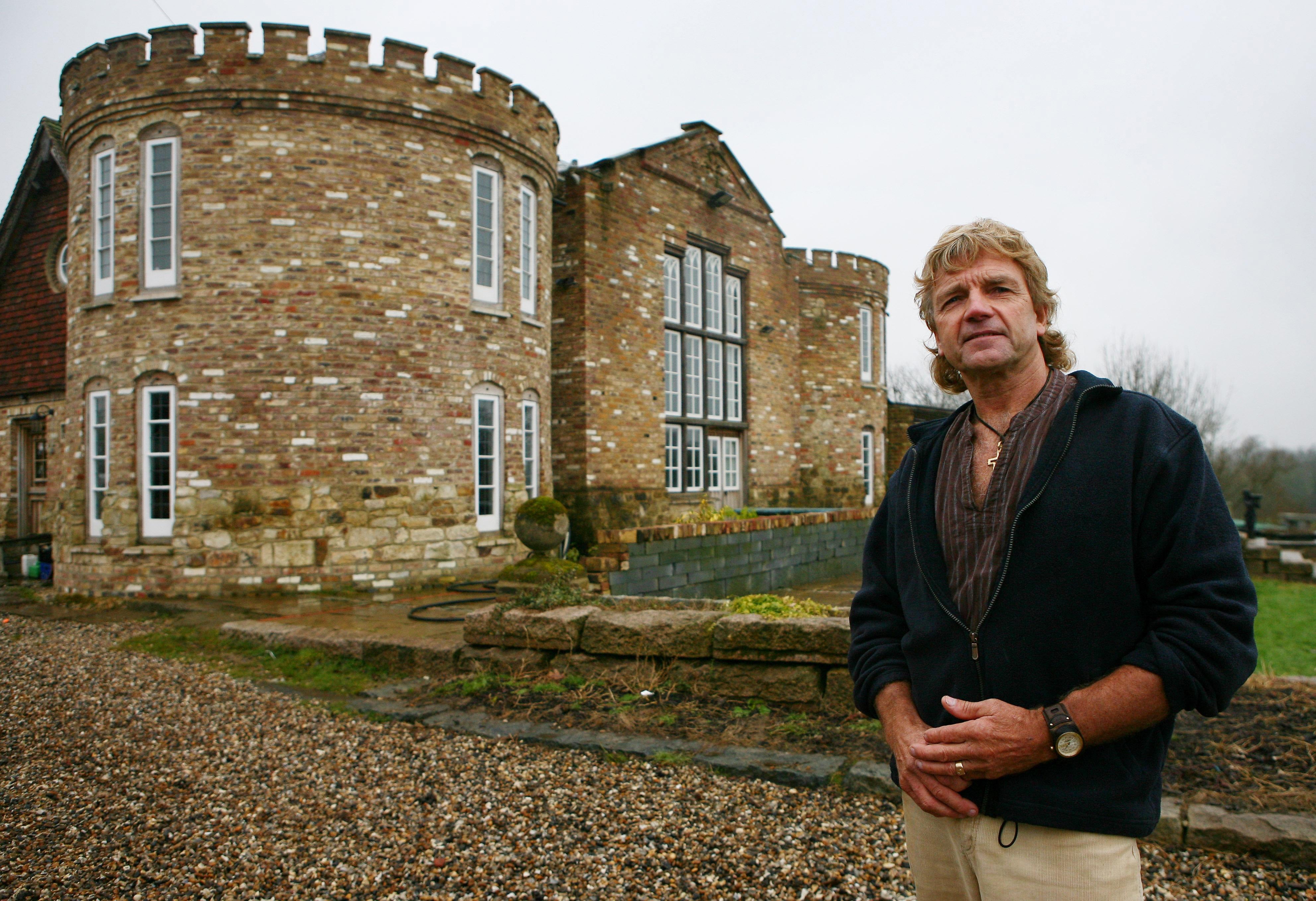 The mock Tudor castle was hidden behind bales of hay before being discovered by the local council and demolished