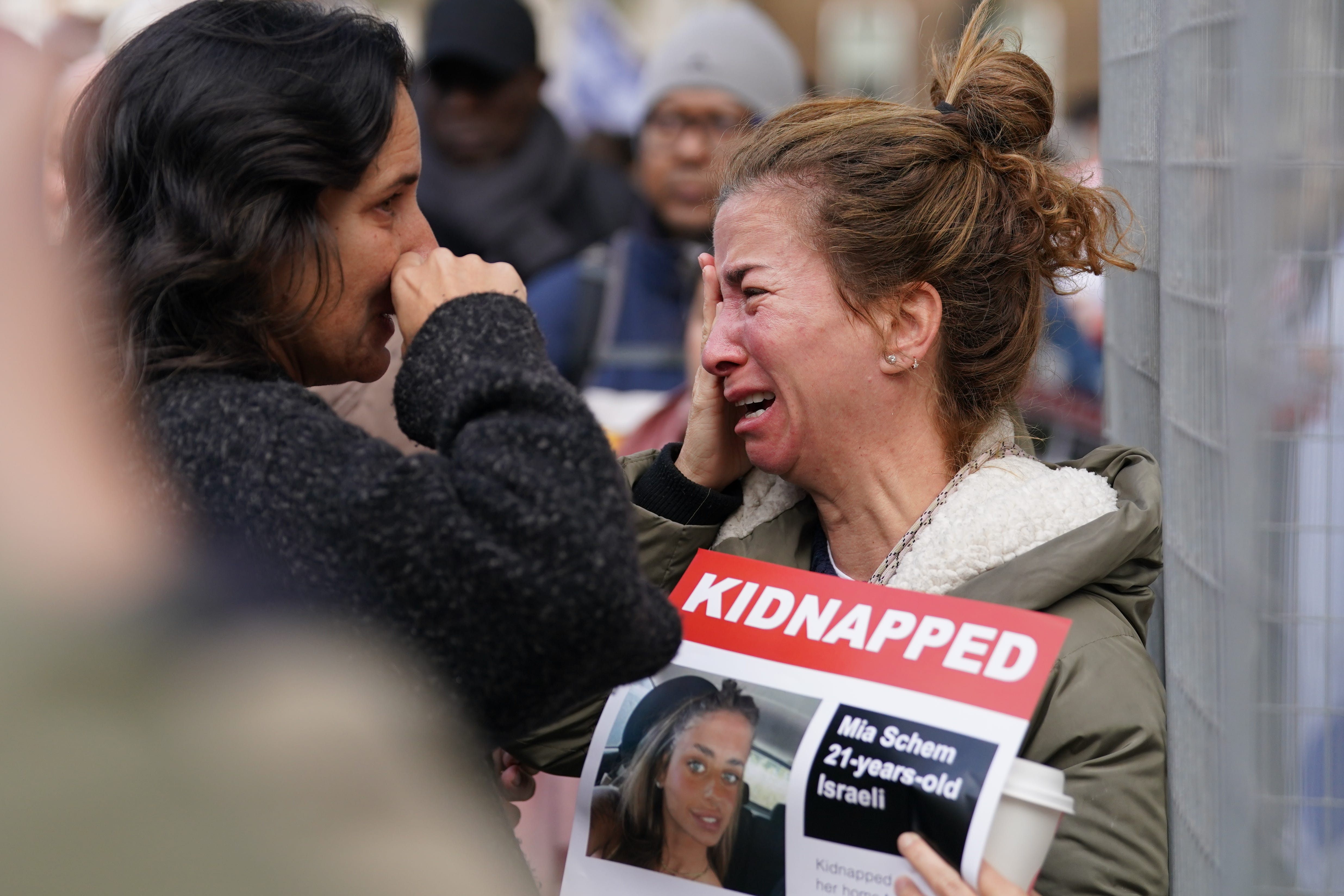 Mourners chanted ‘bring them home’ and held posters of the missing (Gareth Fuller/PA)