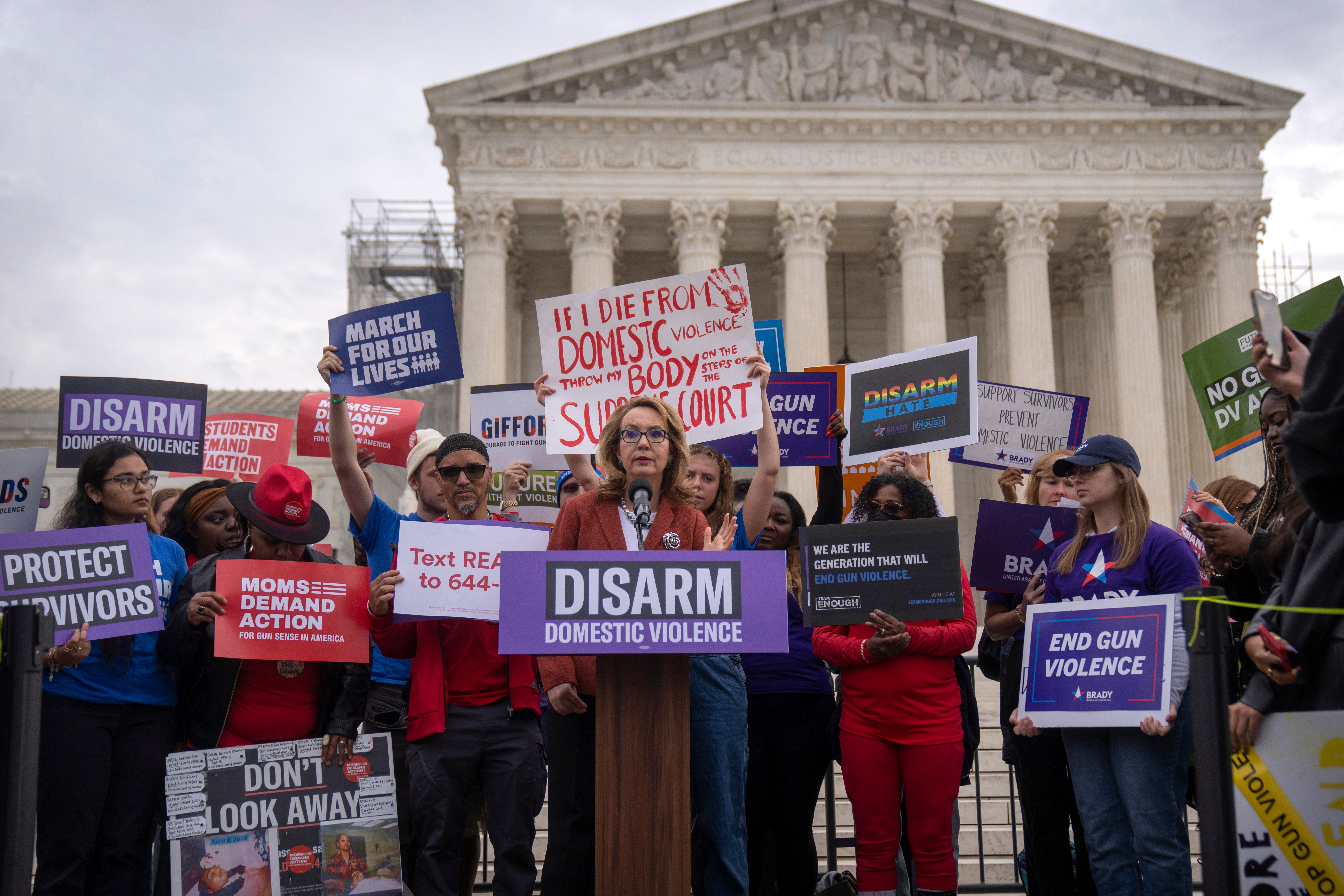 Former congresswoman Gabrielle Giffords speaks outside the US Supreme Court on 7 November during oral arguments in a case challenging federal law prohibiting domestic abusers from keeping firearms.