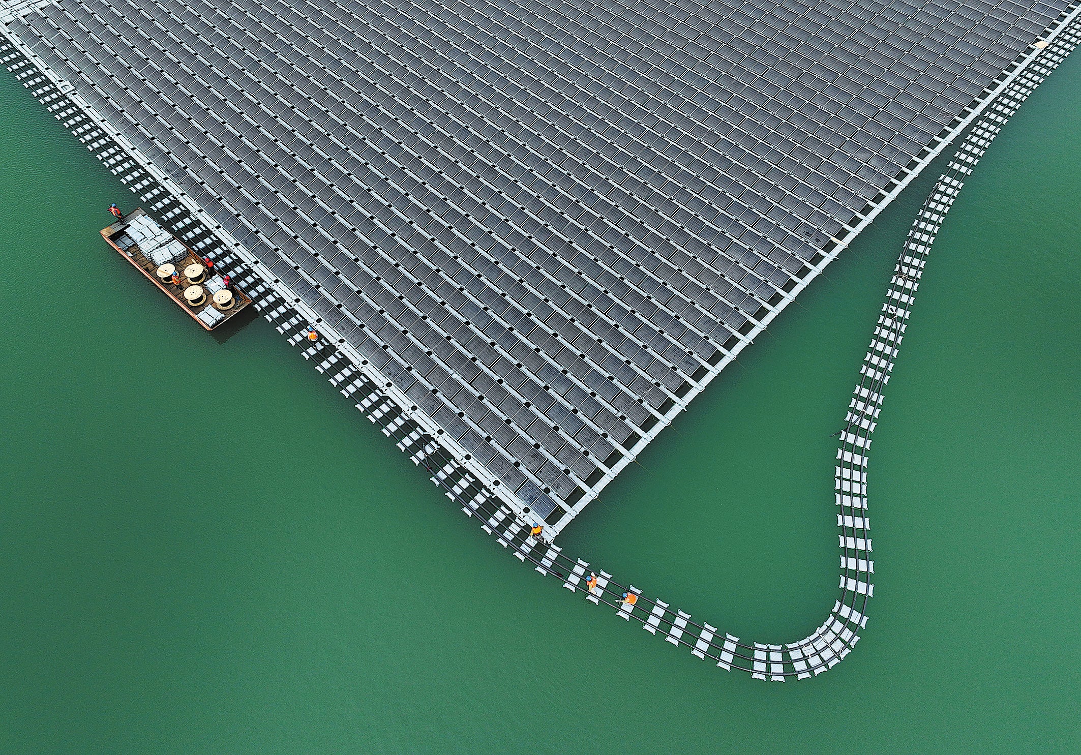 Hundreds of solar panels of a photovoltaic plant float on a reservoir in Liaocheng, Shandong province