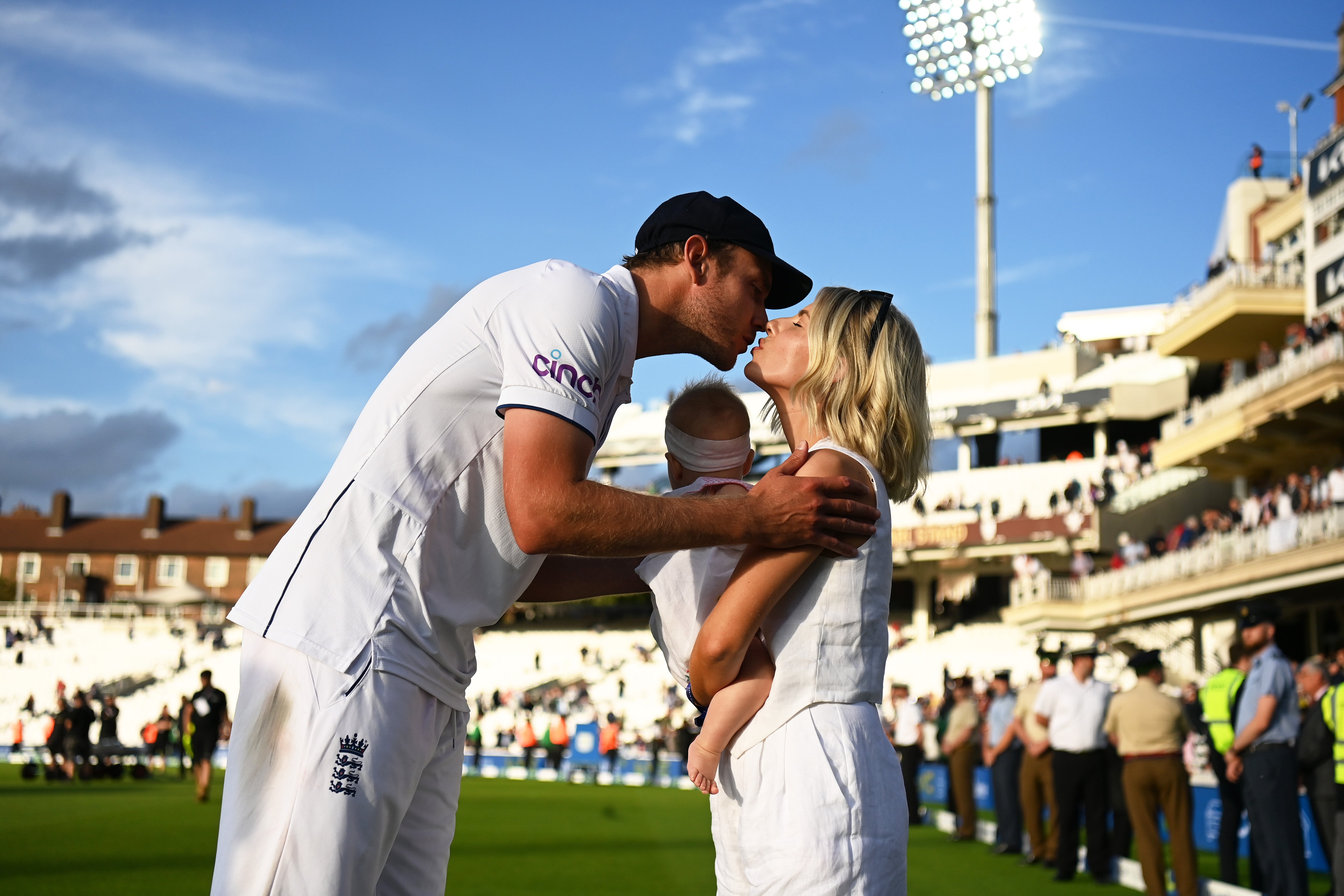 Broad kisses his partner Mollie King following his final match