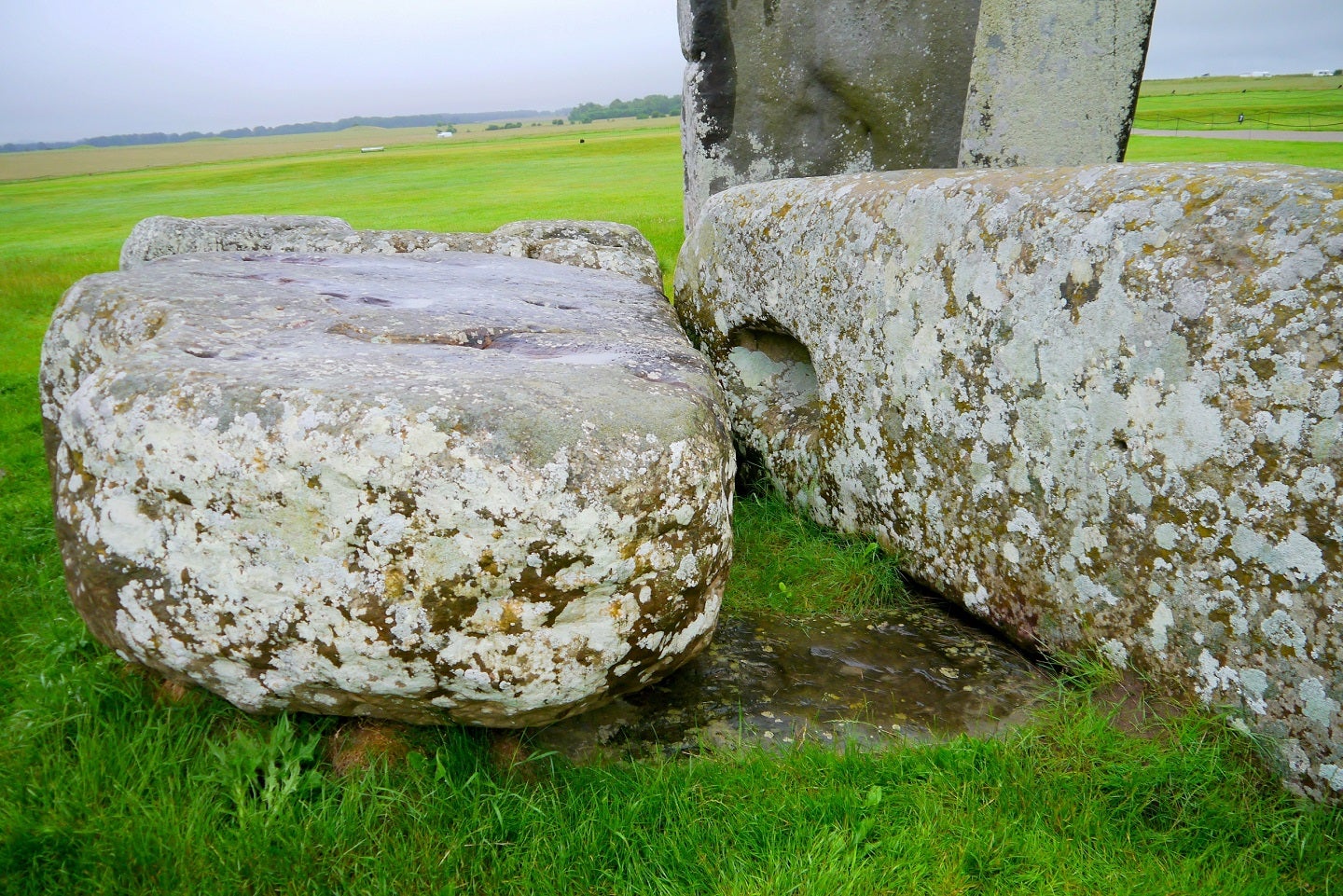 The Altar Stone at Stonehenge, seen here underneath two bigger Sarsen stone