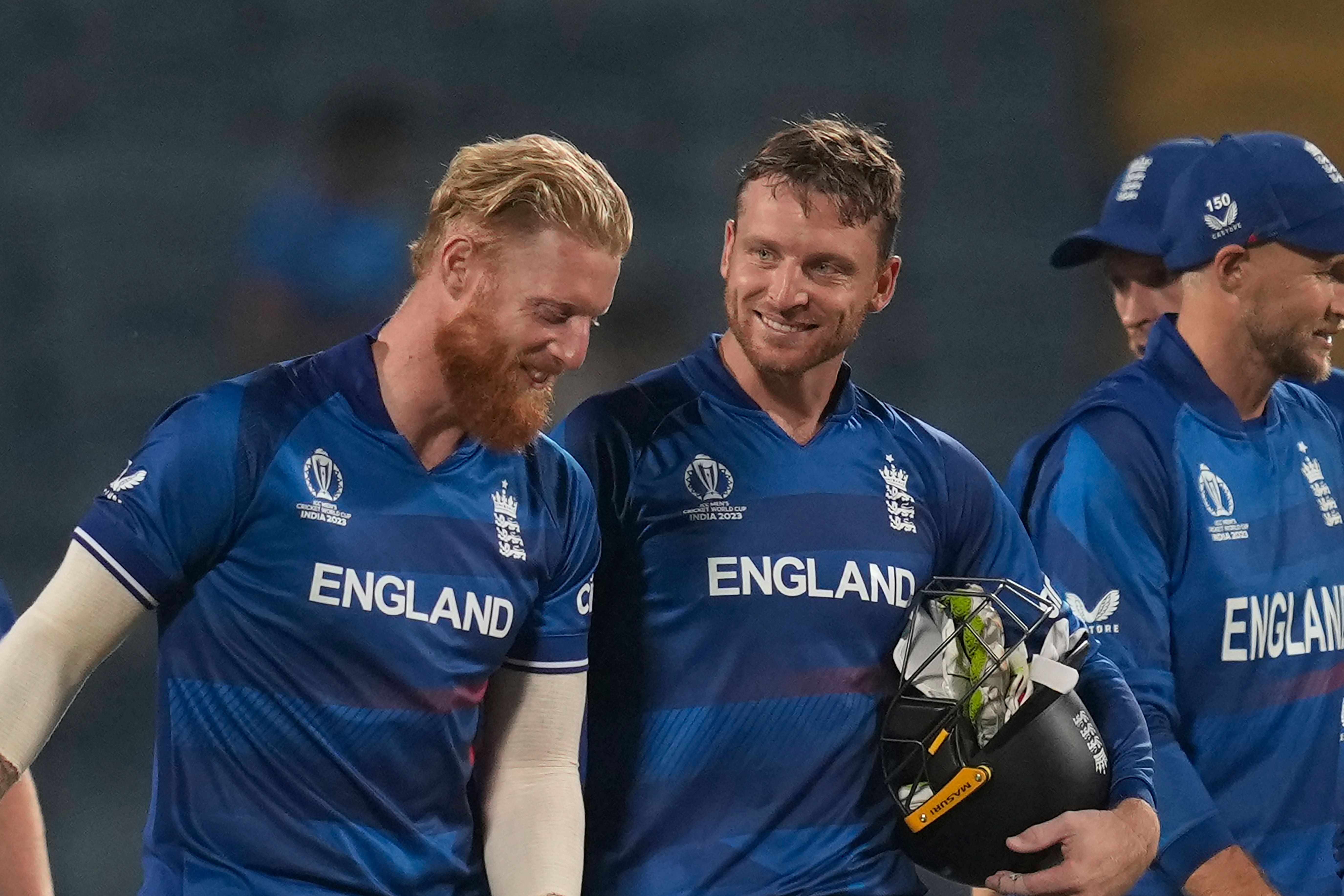 Jos Buttler, centre, has struggled for runs in India (Rafiq Maqbool/AP)