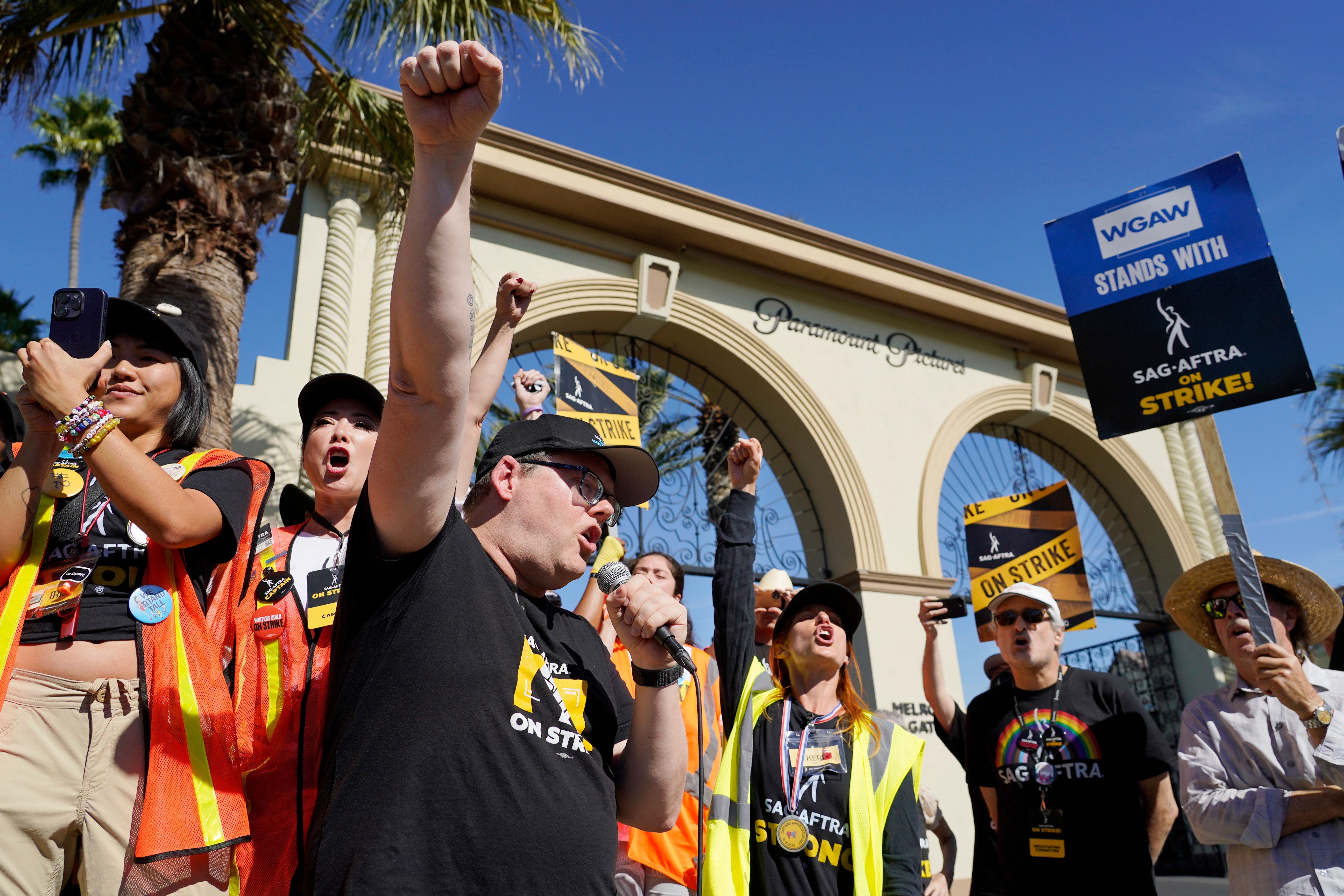 Sag-Aftra chief negotiator Duncan Crabtree-Ireland, left, rallies striking actors in outside Paramount Pictures studio (Chris Pizzello/AP)